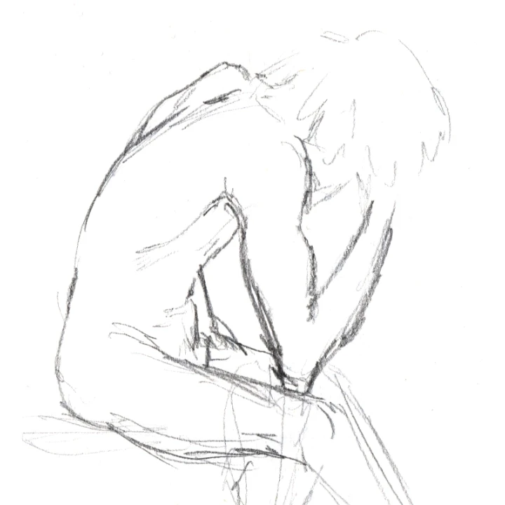 Life drawing of a man leaning over and holding his head in his hands