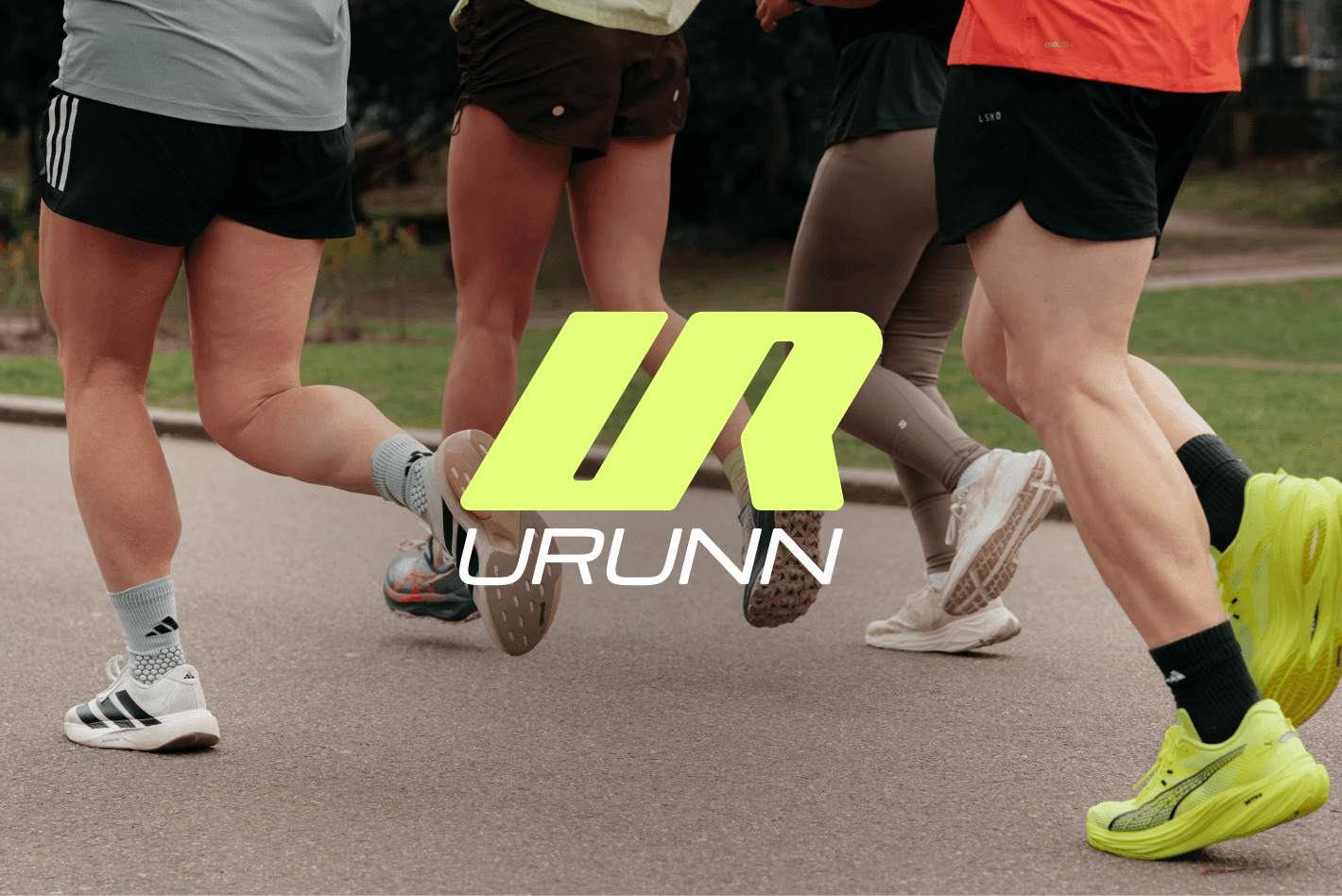 Runners' legs mid-race with URUNN logo overlay