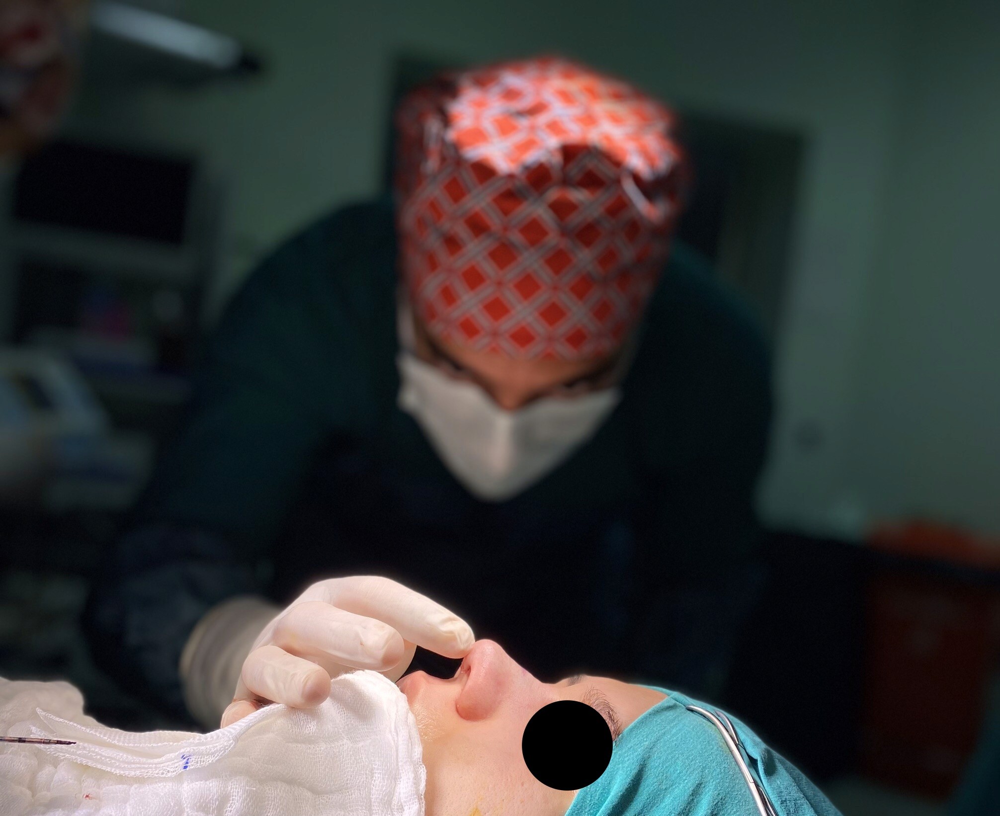 Dr CBS doing final check during rhinoplasty