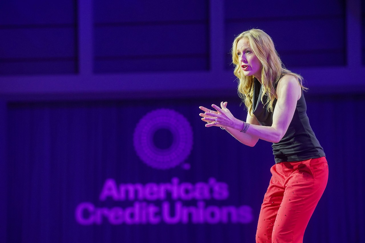 Woman giving a presentation on stage