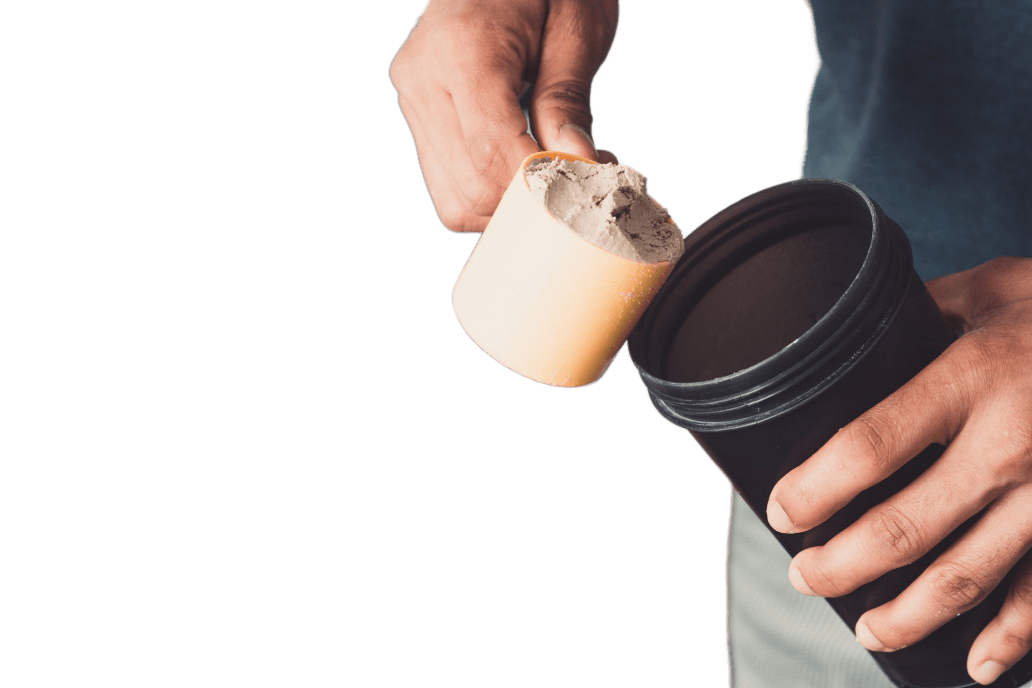 Person preparing a supplement drink with a scoop and shaker bottle.