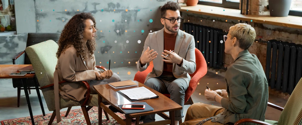 three people meeting together