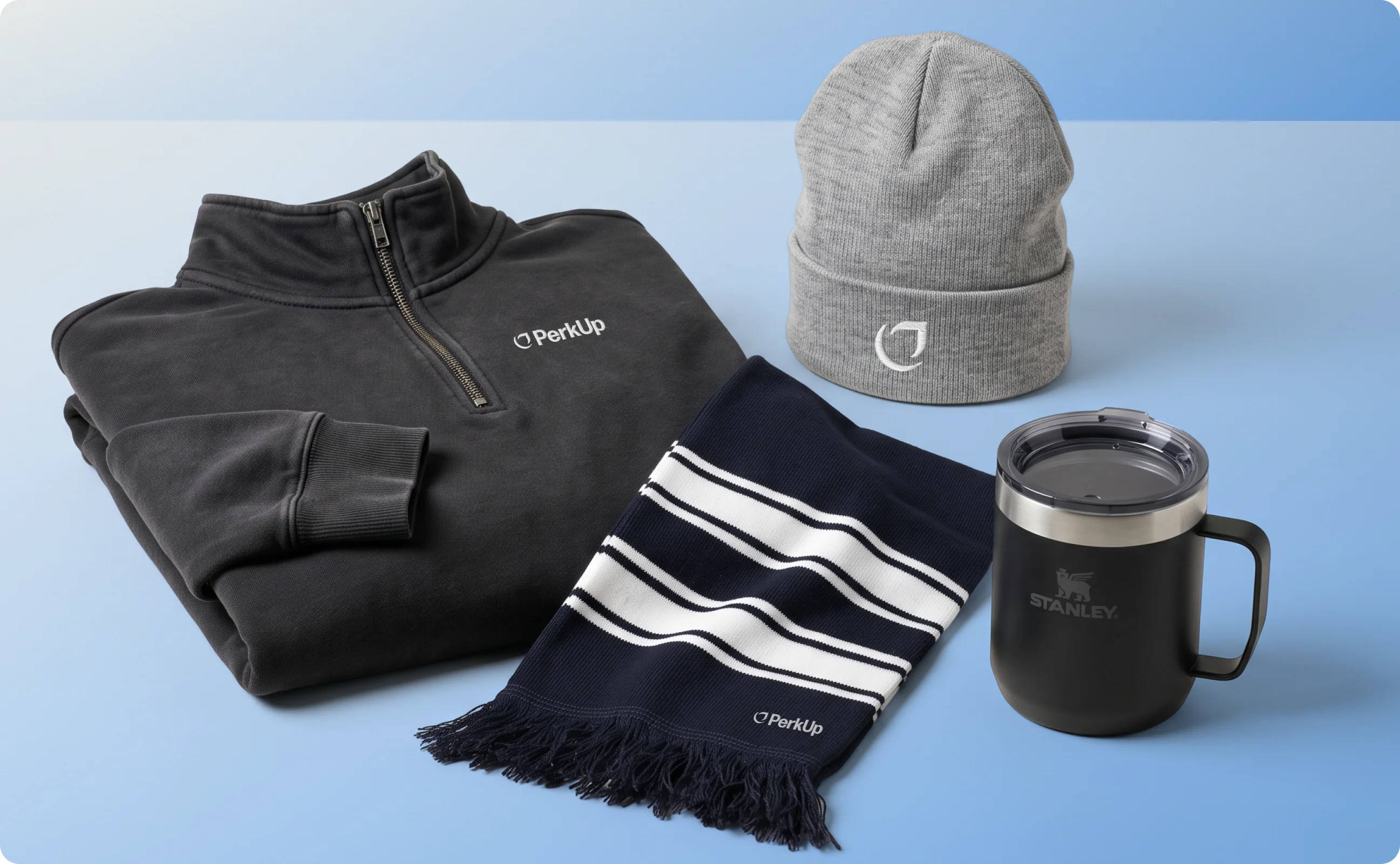 Swag items like a quarter zip, scarf, beanie, and insulated mug.