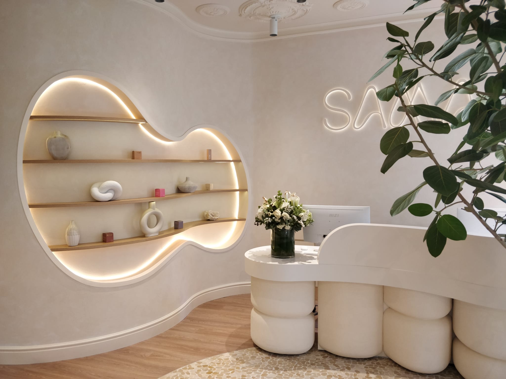 Curved shelf lobby with lights and desk