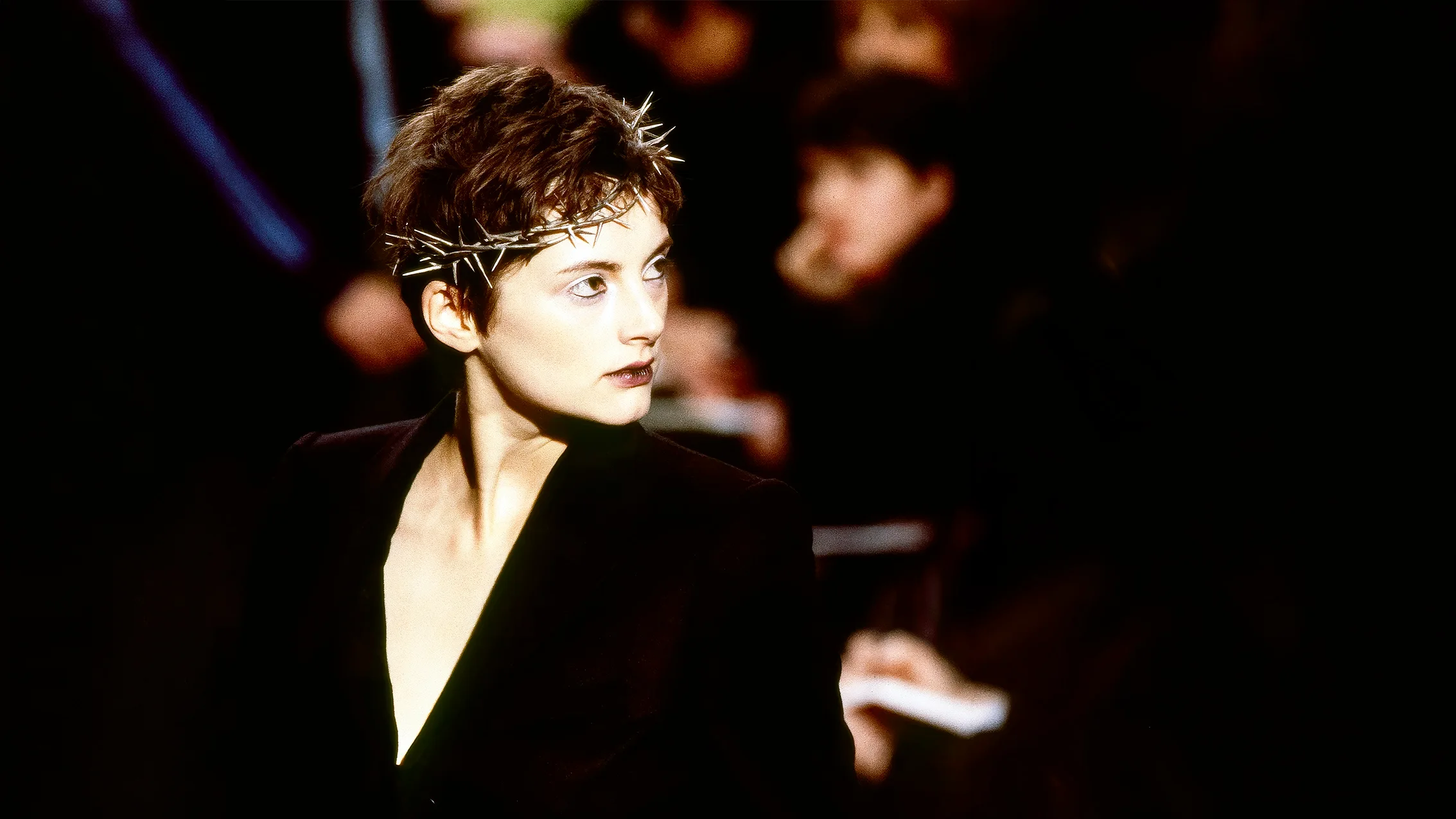 Close-up of a model wearing the silver metal Crown of Thorns headpiece designed by Shaun Leane for Alexander McQueen’s iconic Dante Autumn/Winter 1996 runway show.
