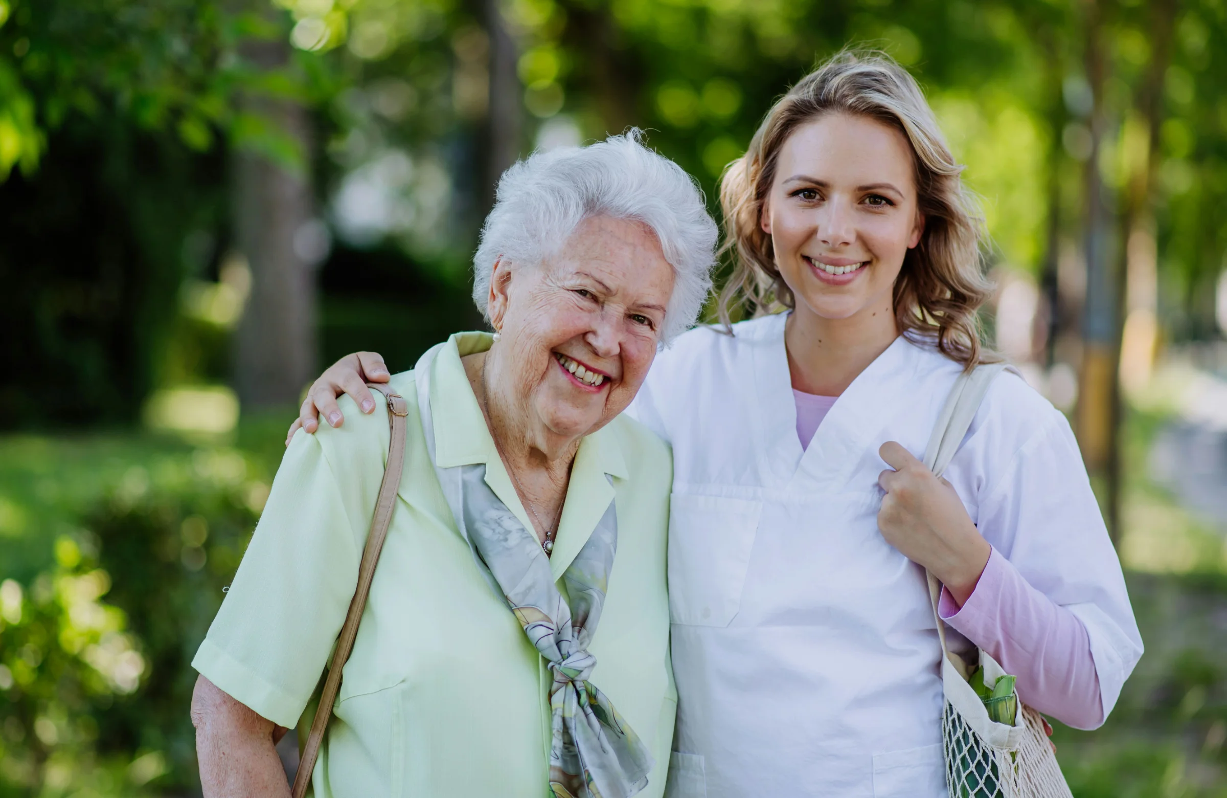Community nurse and older client together outdoors in Brisbane