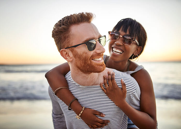 woman holding man from behind