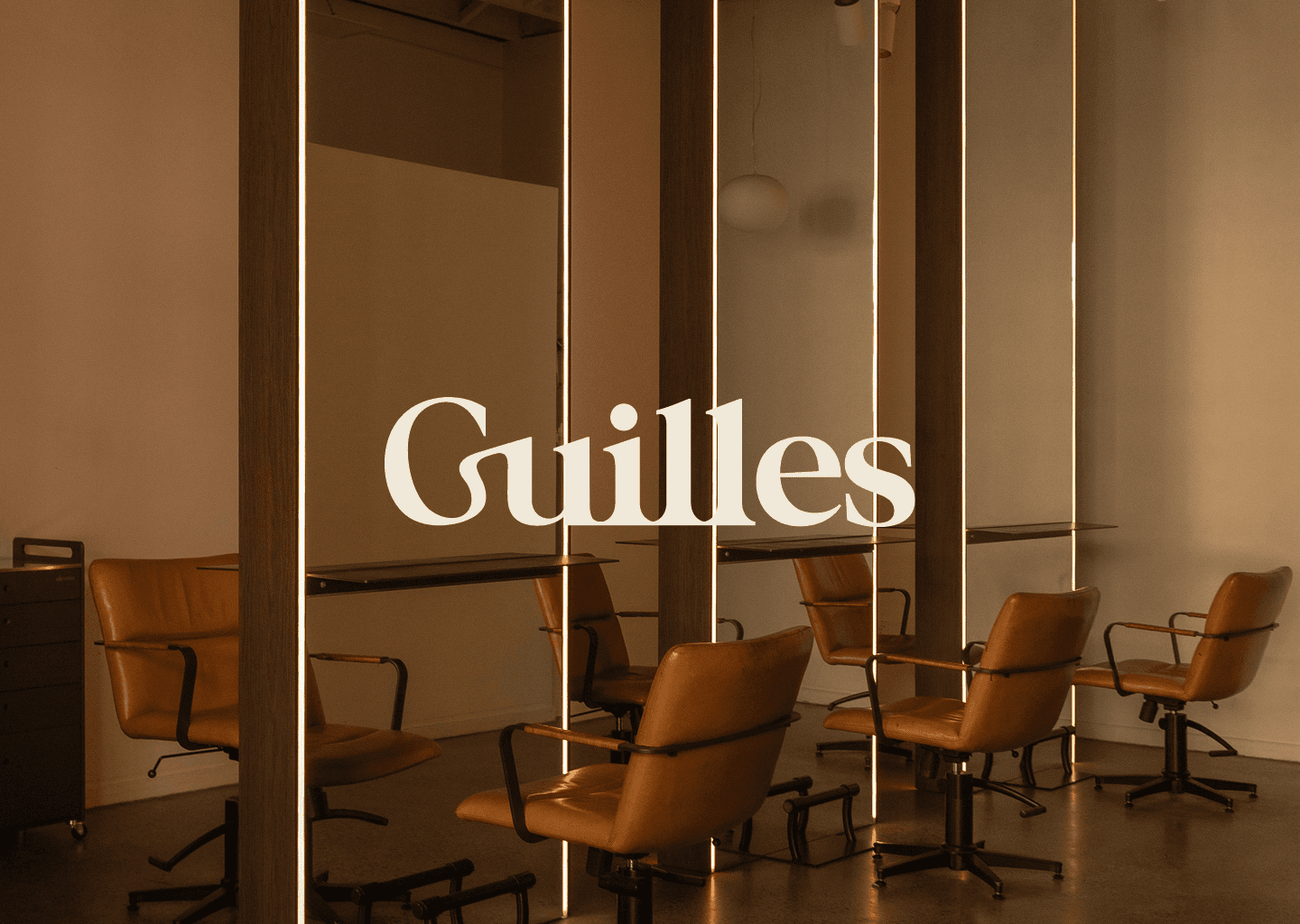 Branding image for a luxury hair salon named Guilles based in Sydney, featuring sleek hair and the Guilles logo.