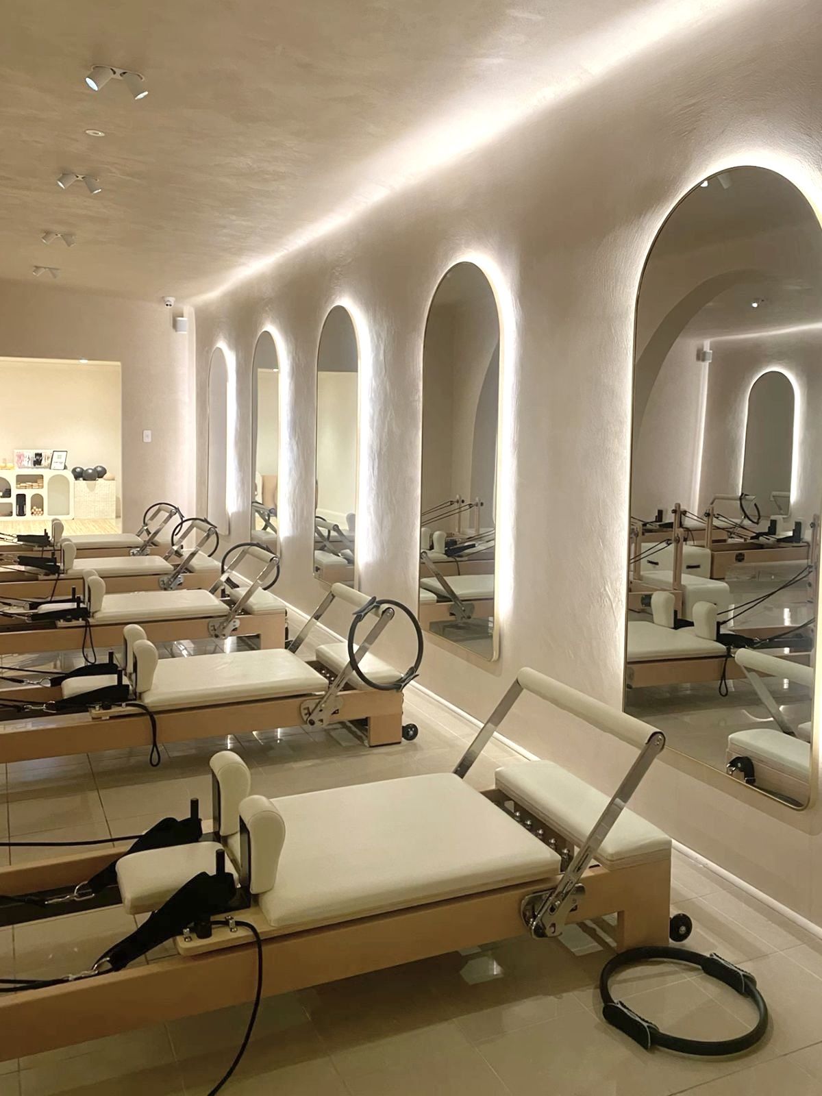 A cozy scene with warm sunlight casting stripes, featuring a potted plant and soft towels on a window sill.