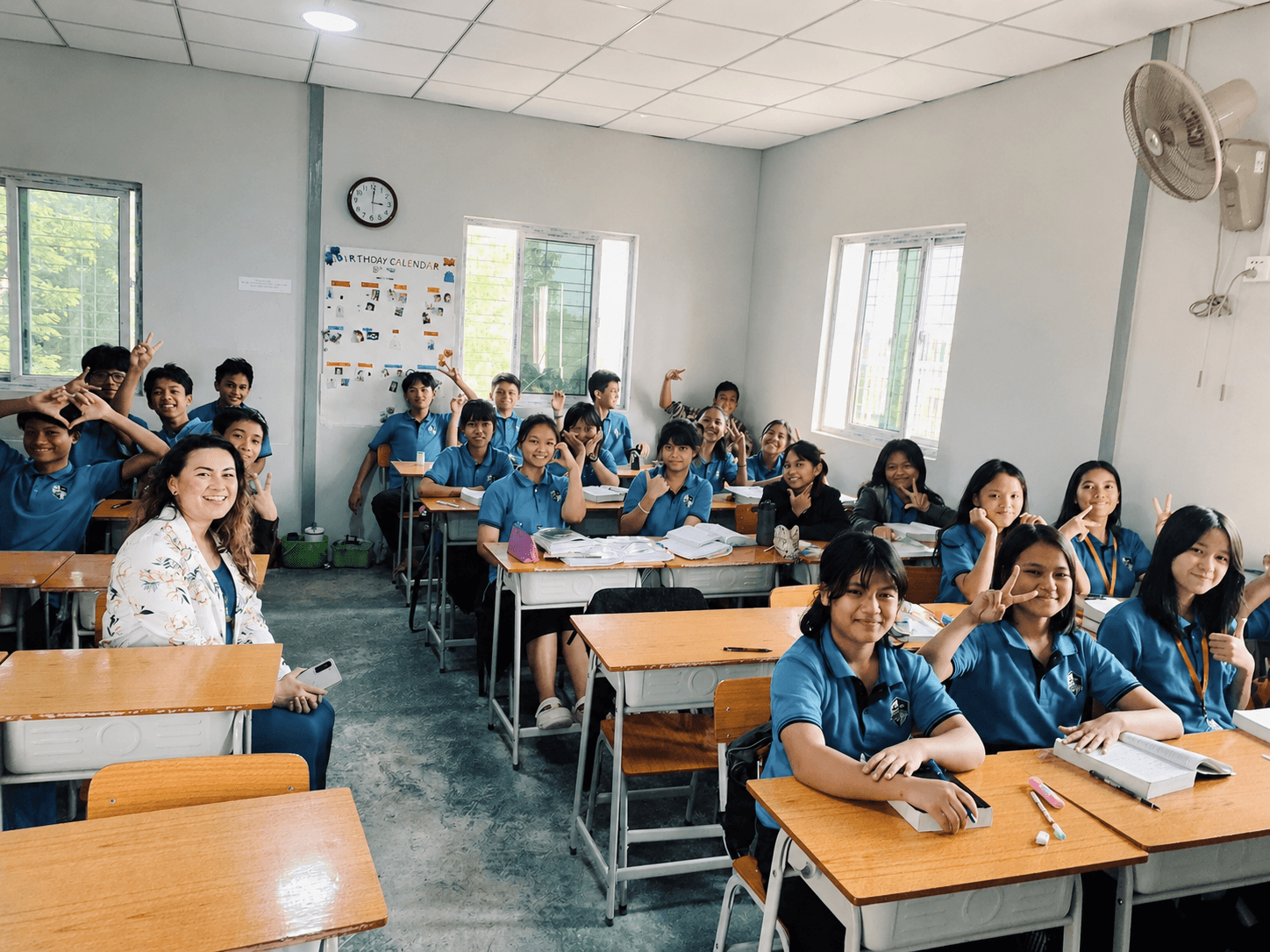 Elpis International School students smiling together in a classroom in Yangon, Myanmar