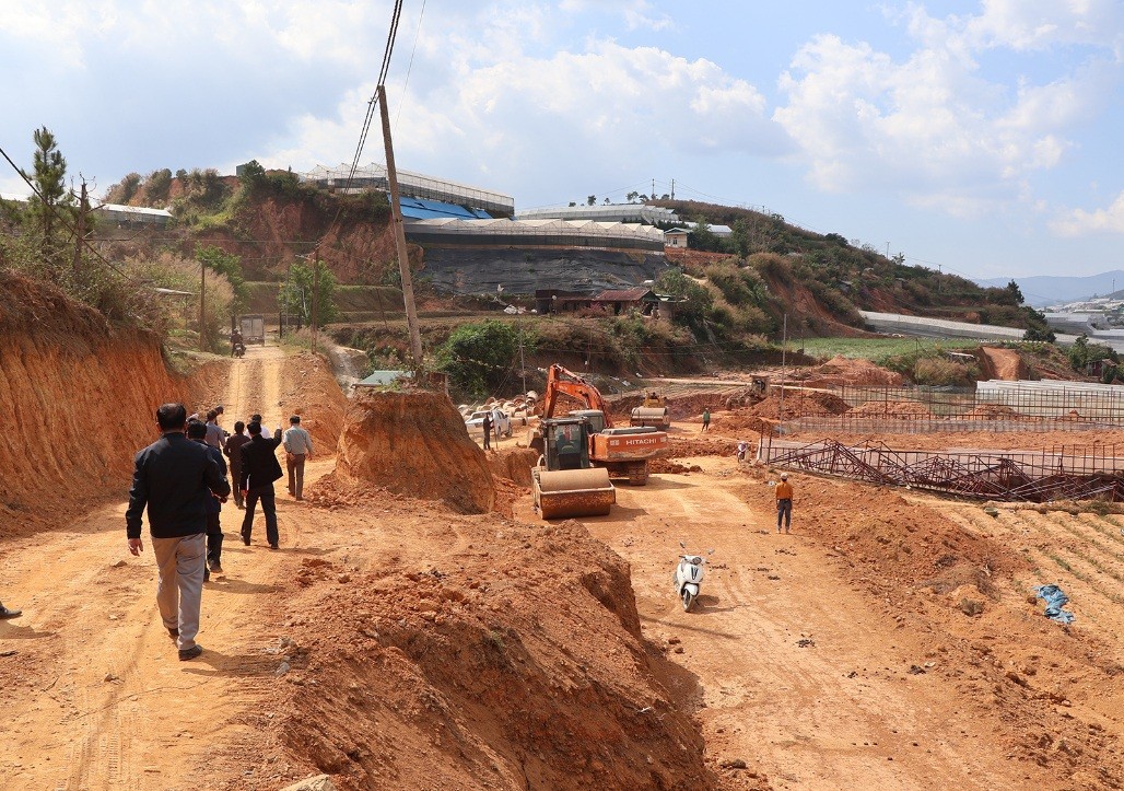 man and woman holding white paper