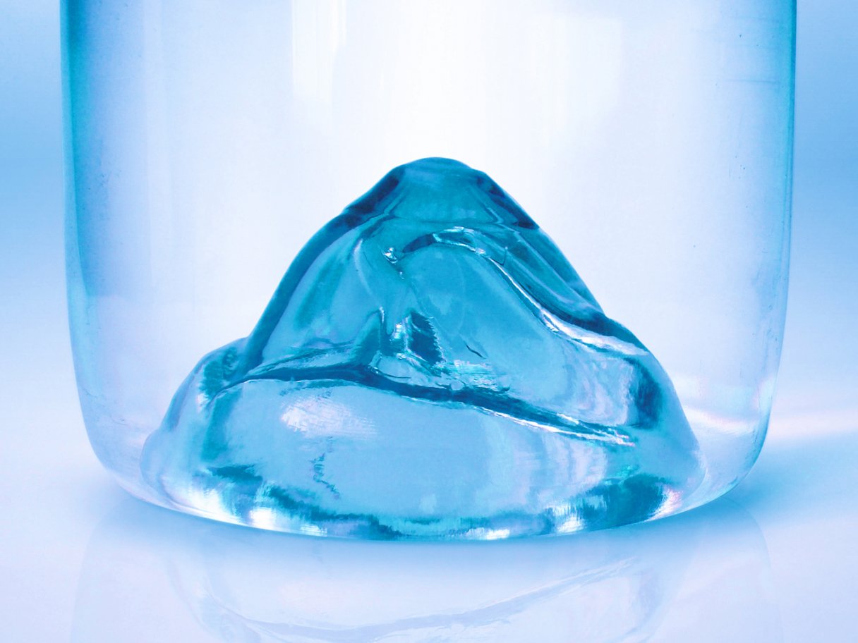 Rooftops of a coastal town with the sea in background