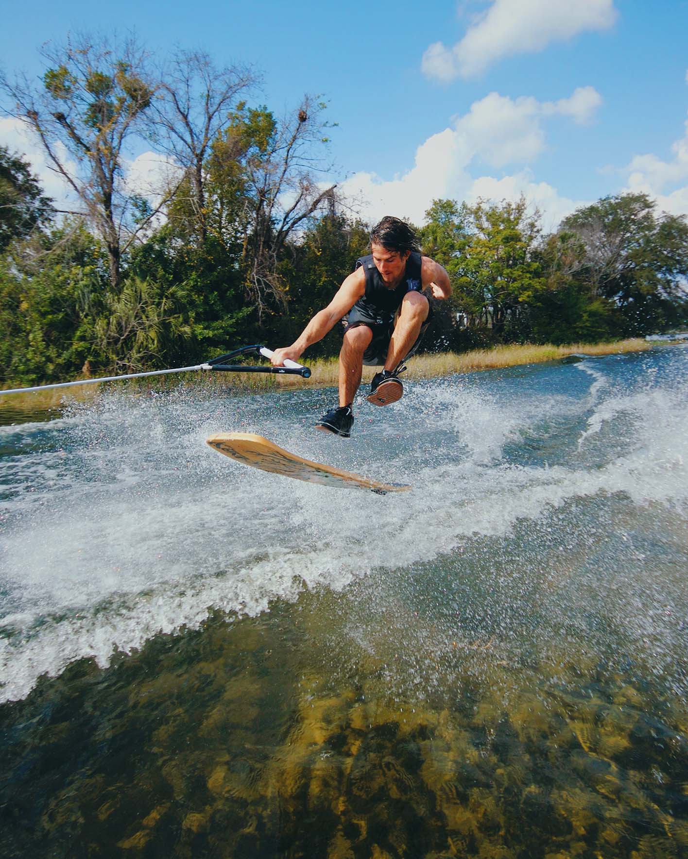 Kyle Hyams wakeskating through a canal (photo by Adam Aslanian)