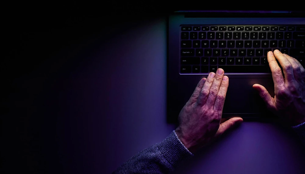 male hands are typing laptop keyboard