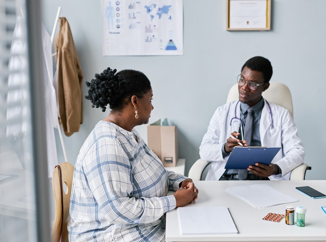 woman meeting with her doctor to discuss a prescription med for weight loss