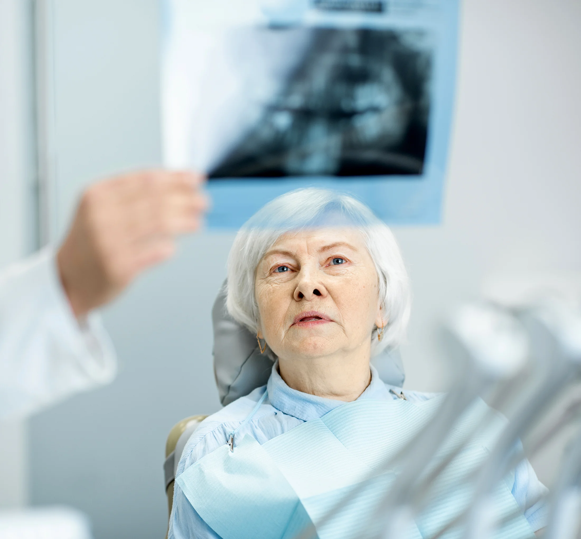 Patient reviewing dental imaging during a bone grafting consultation at Valley Oak Oral Surgery in Fresno, CA.