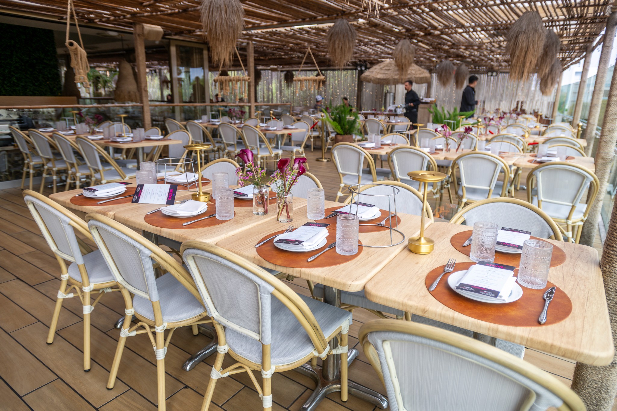 A close-up of a well-plated meal on a beautifully set dining table for summit guests.