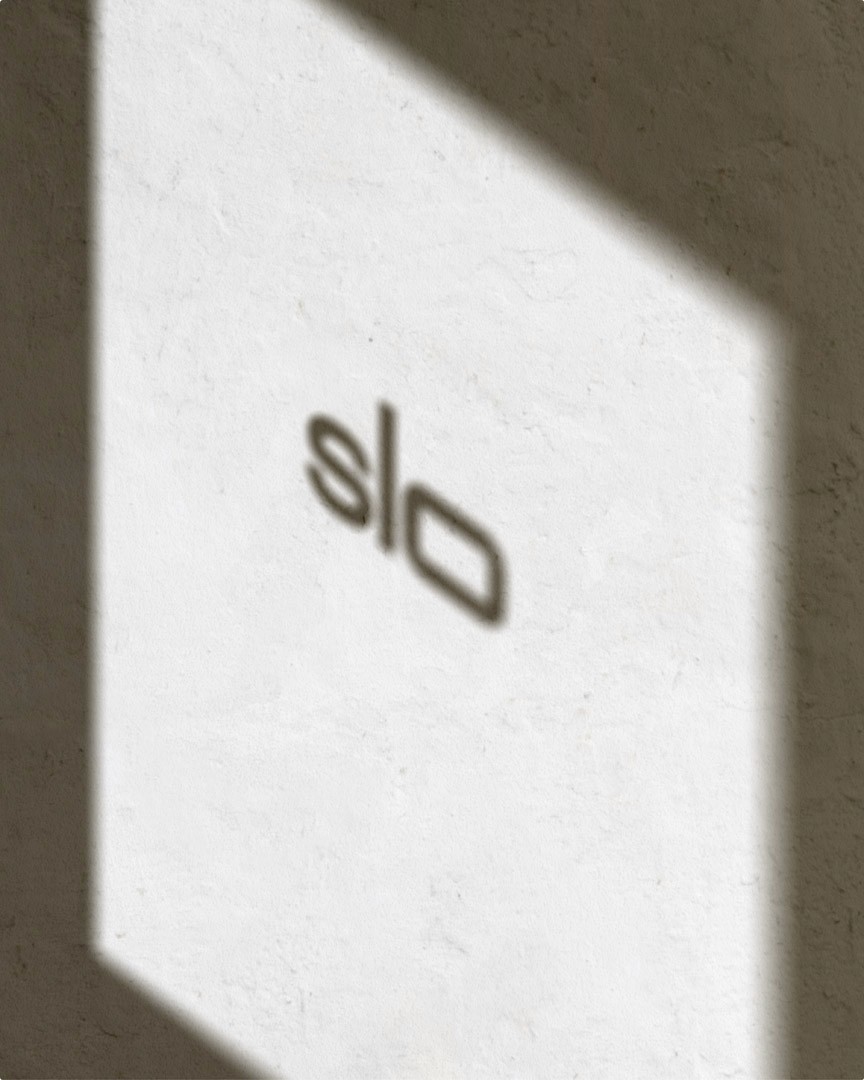 SLO logo reflection on a wall