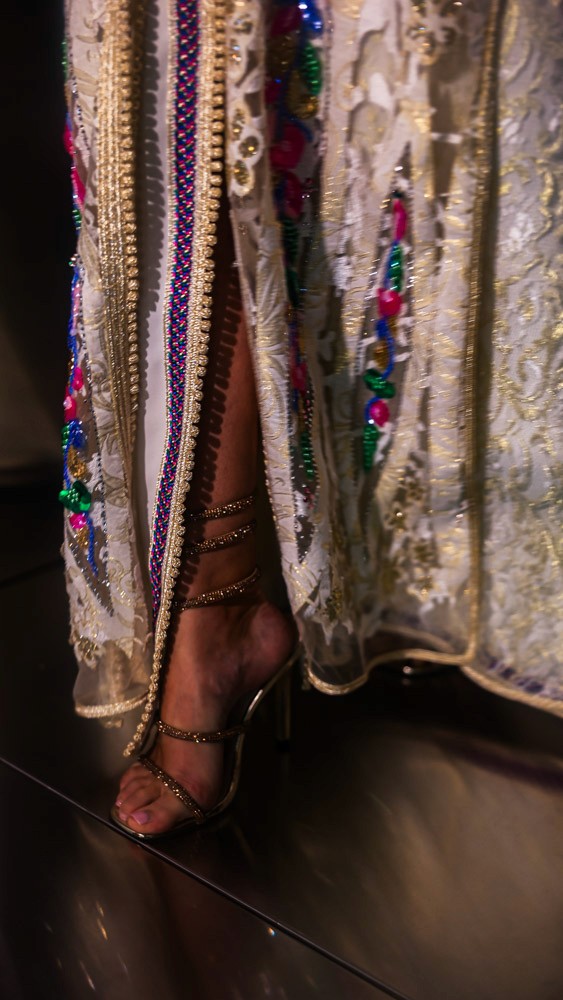 Ivory Moroccan caftan with colorful floral embroidery, handcrafted luxury piece for elegant events in Bahrain