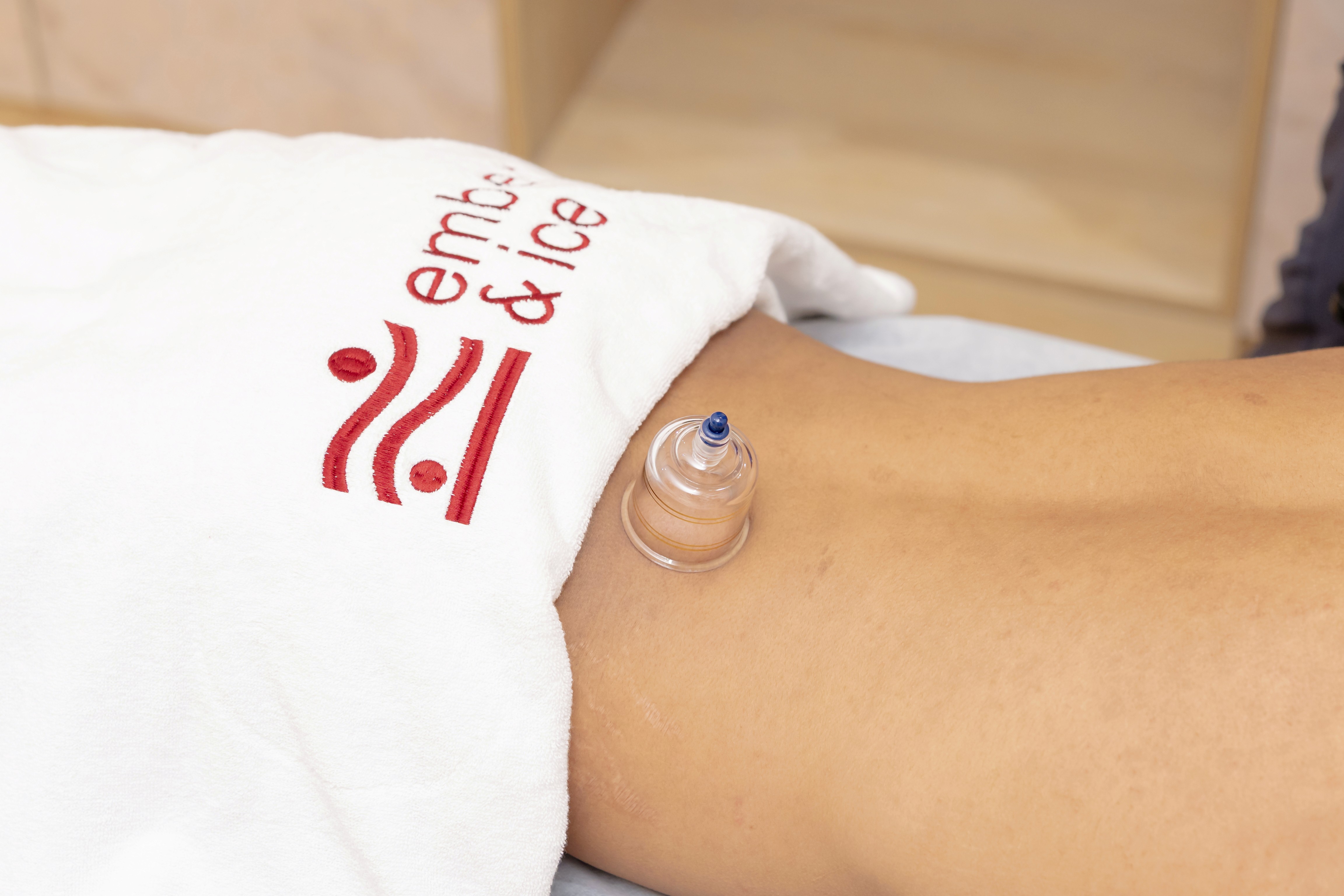 Man receiving cupping therapy treatment at Ember & Ice Health physiotherapy and recovery center in Bangalore.