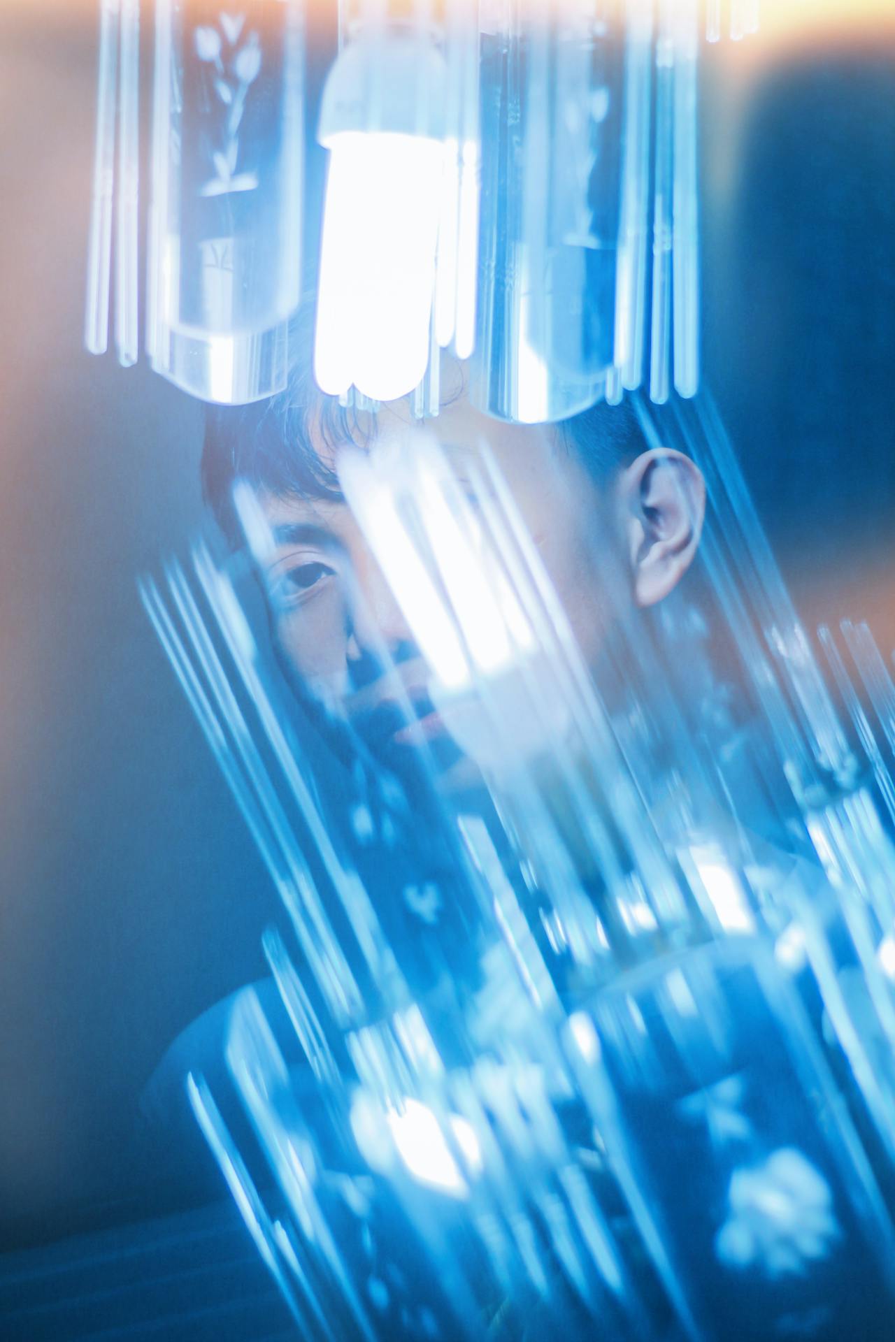 Colourful and vibrant image of a human interacting with technology.