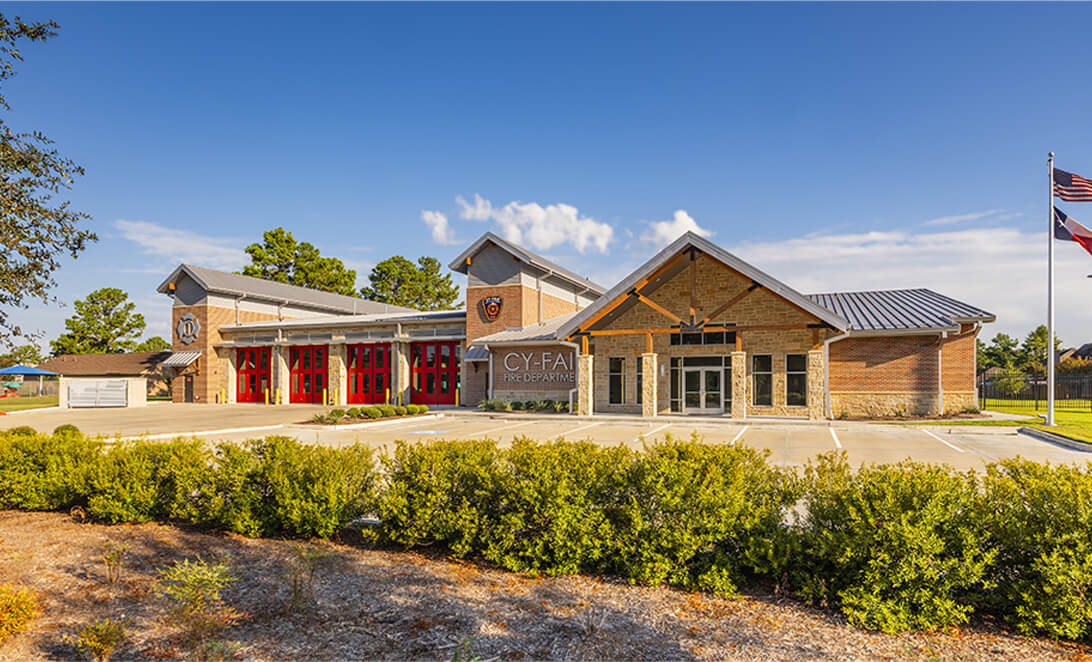 Fire Department facility exterior with apparatus bay doors and main entry. Cy-Fair Fire Station 1.