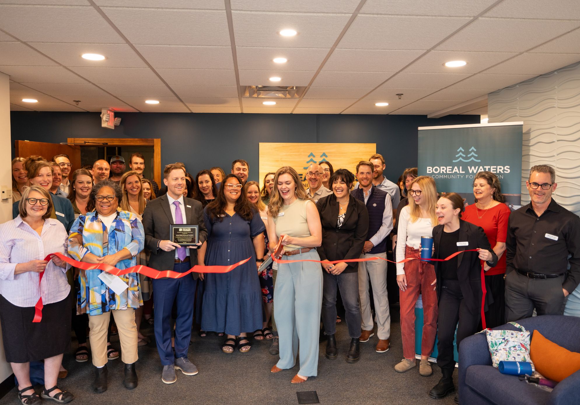 Boreal Waters team cuts ribbon for new brand