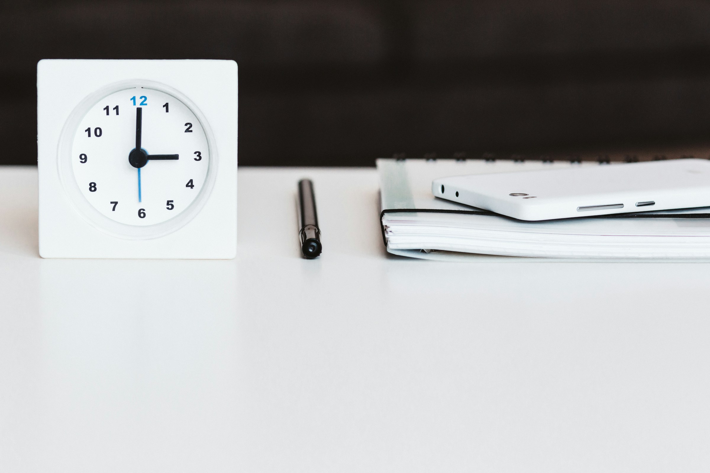 clock with a notebook - How Long Does It Take To Write A Research 