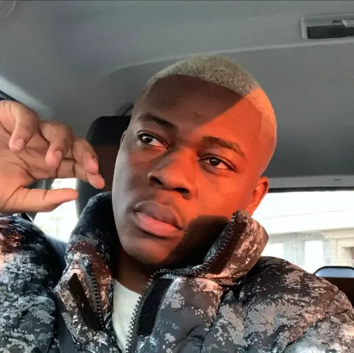 A person wearing the white shirt looking at the left