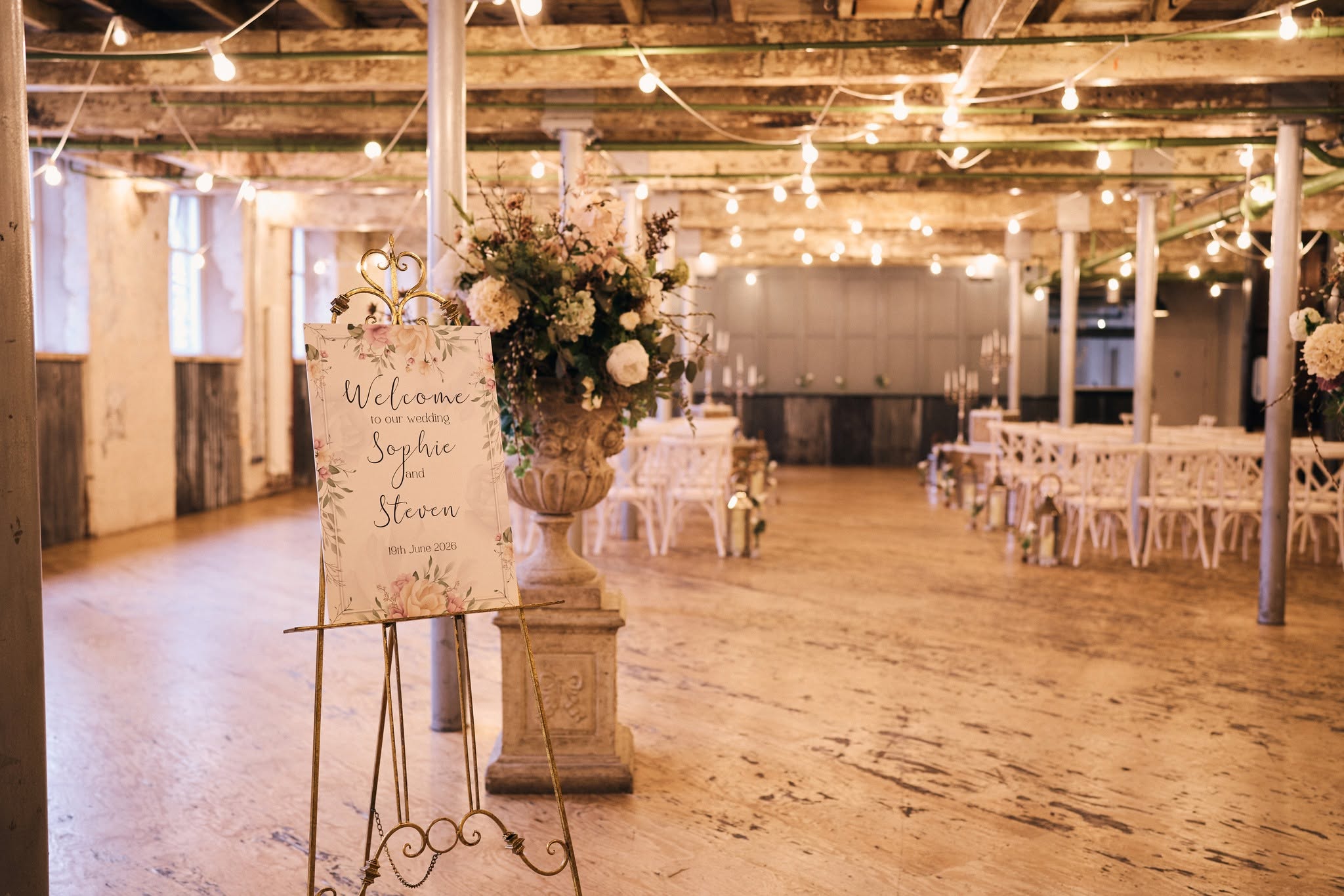 Ceremony room set up with festoon lights at Holmes Mill, Clitheroe
