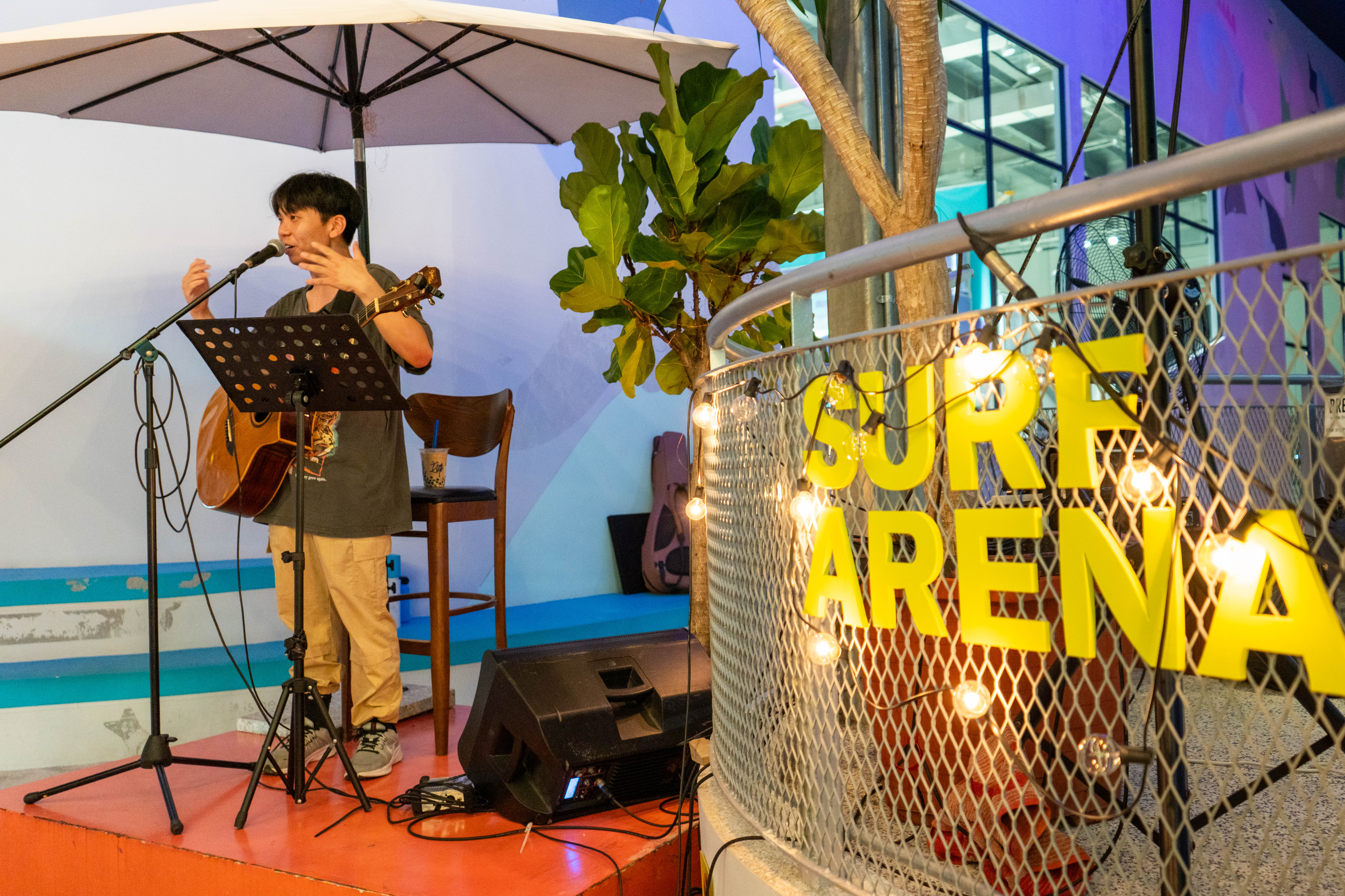 Guitar and singing performance by Ezekiel at Surf Arena