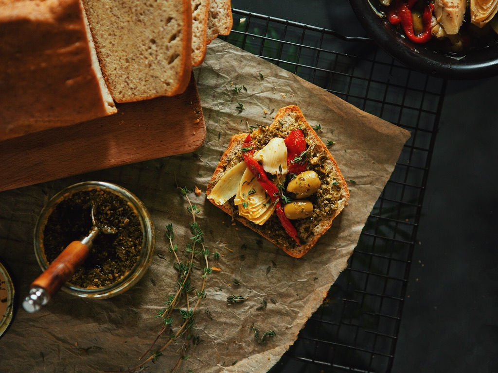 Various dried flowers and plants arranged on a light background.