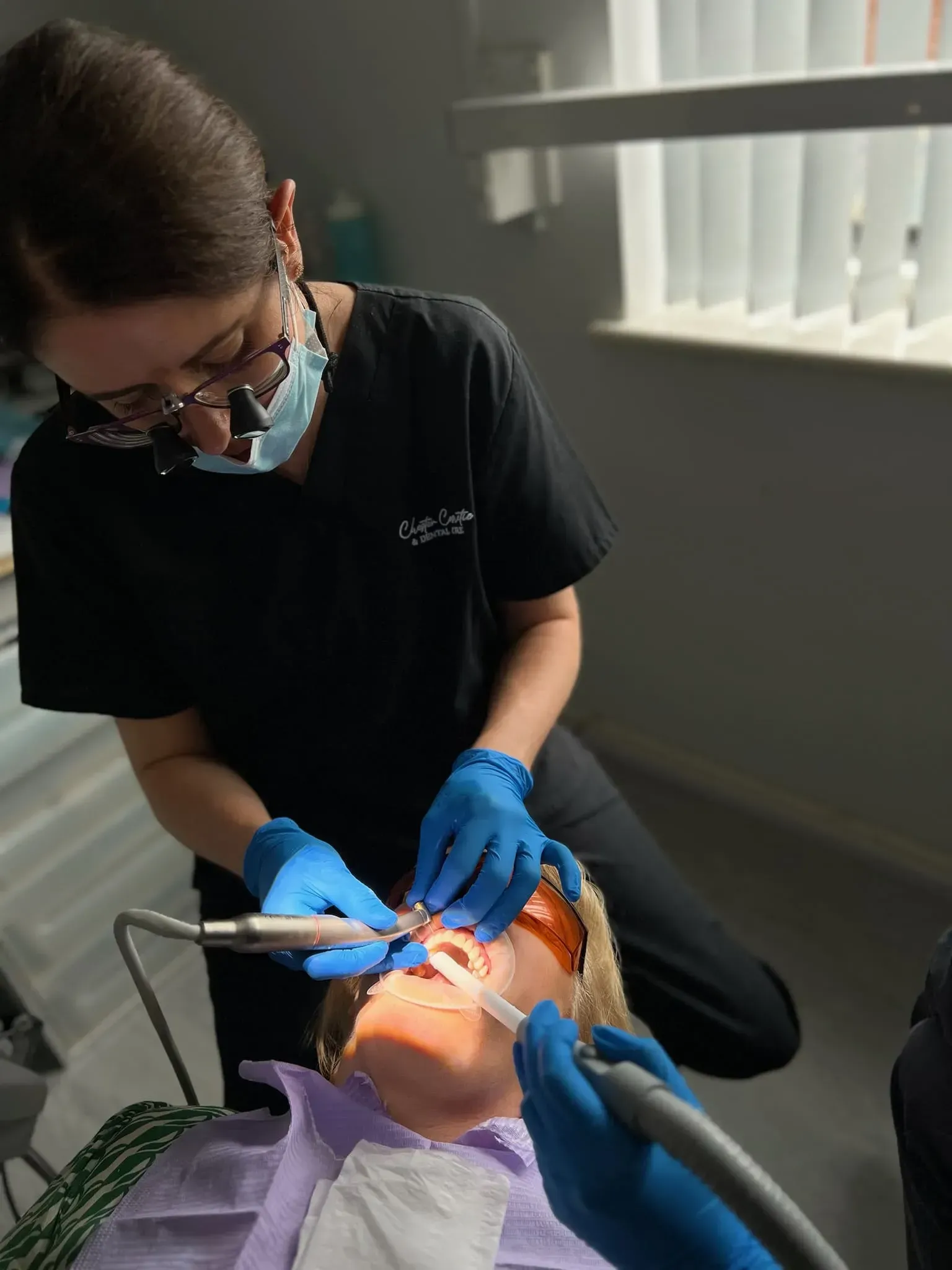Dr April doing her dental work on a patient.