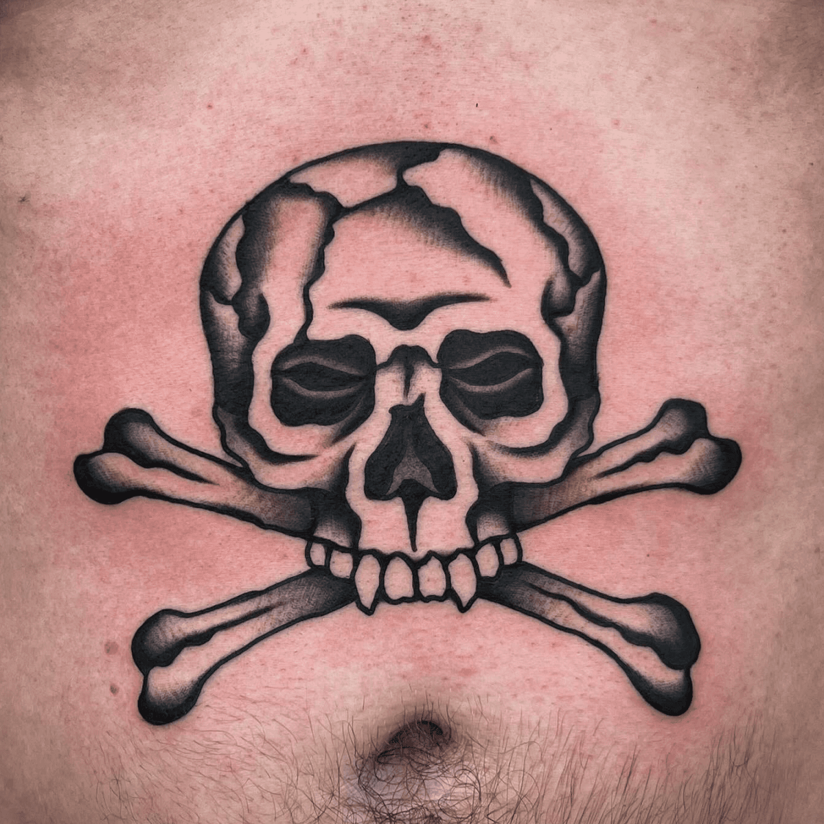 black and gray tattoo of a skull