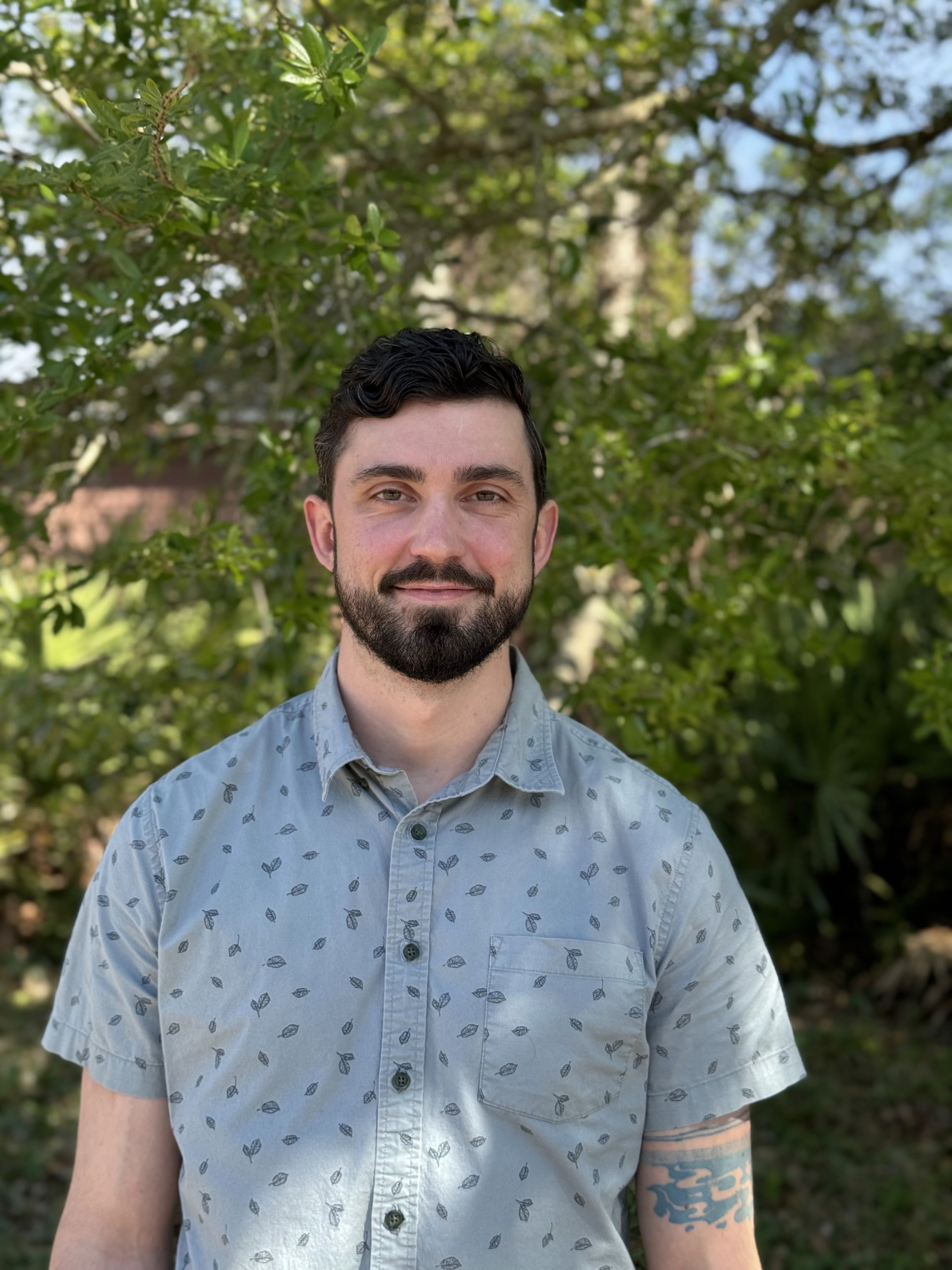 Photograph of Tim standing outside