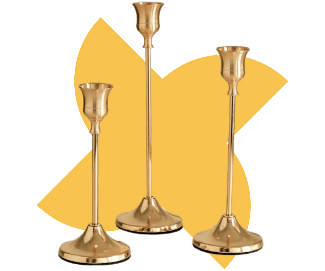 Image of 3 brass candlesticks, all sized differently.