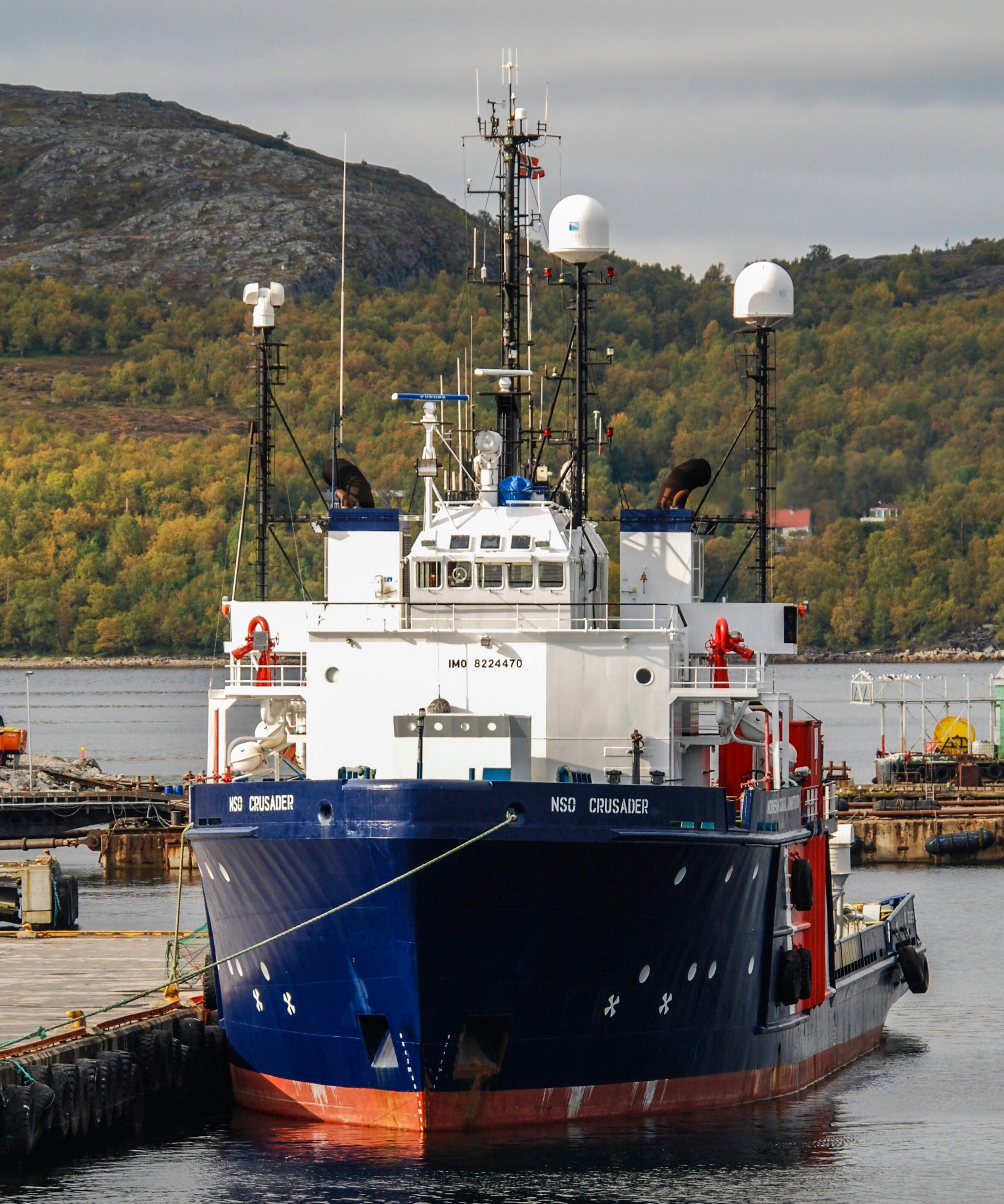 a large blue and white boat in a body of water