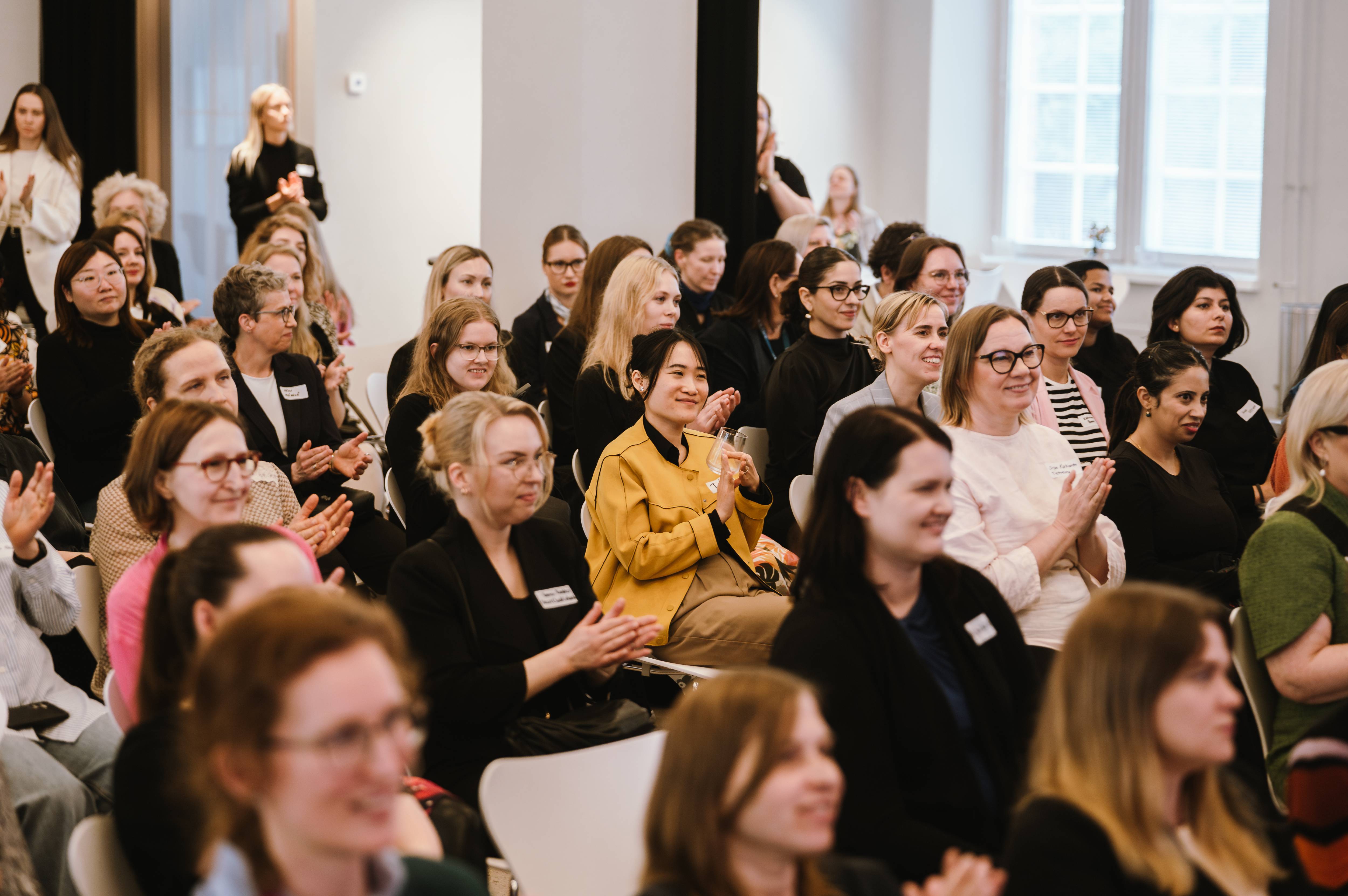 Group of women sitting in the audiences
