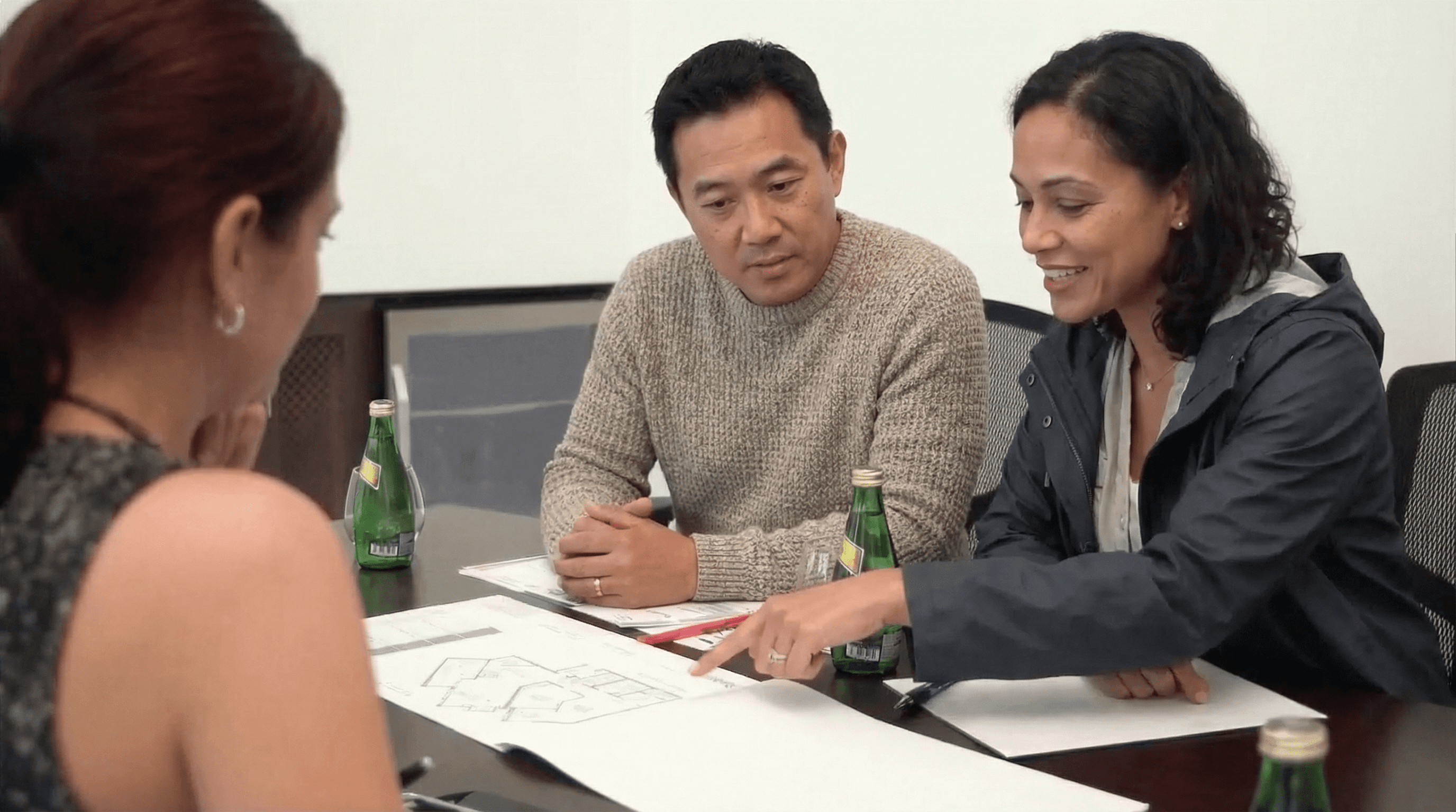 Couple discussing their custom home cost per square foot in Vancouver, and how much it will cost to build a house in Vancouver BC