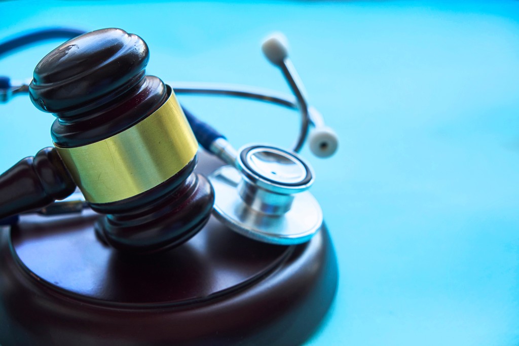 judge gavel and medical tools for settlement imagery