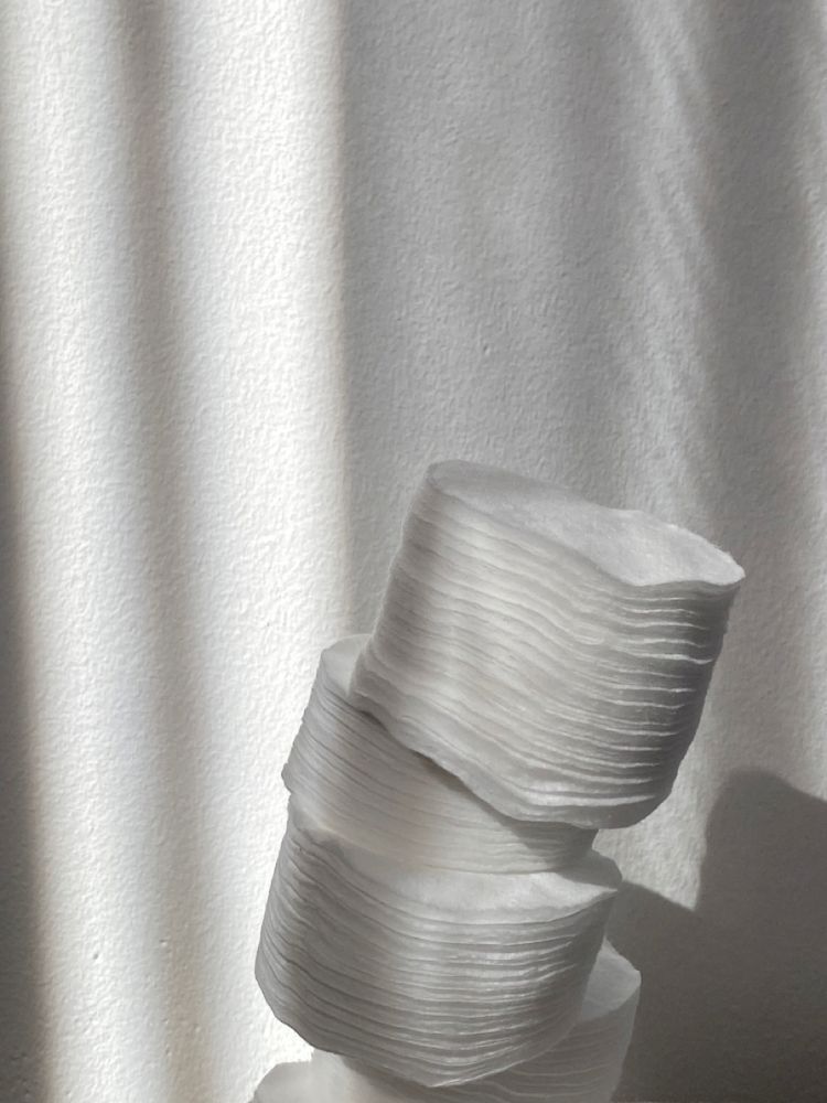 white cotton buds on white surface