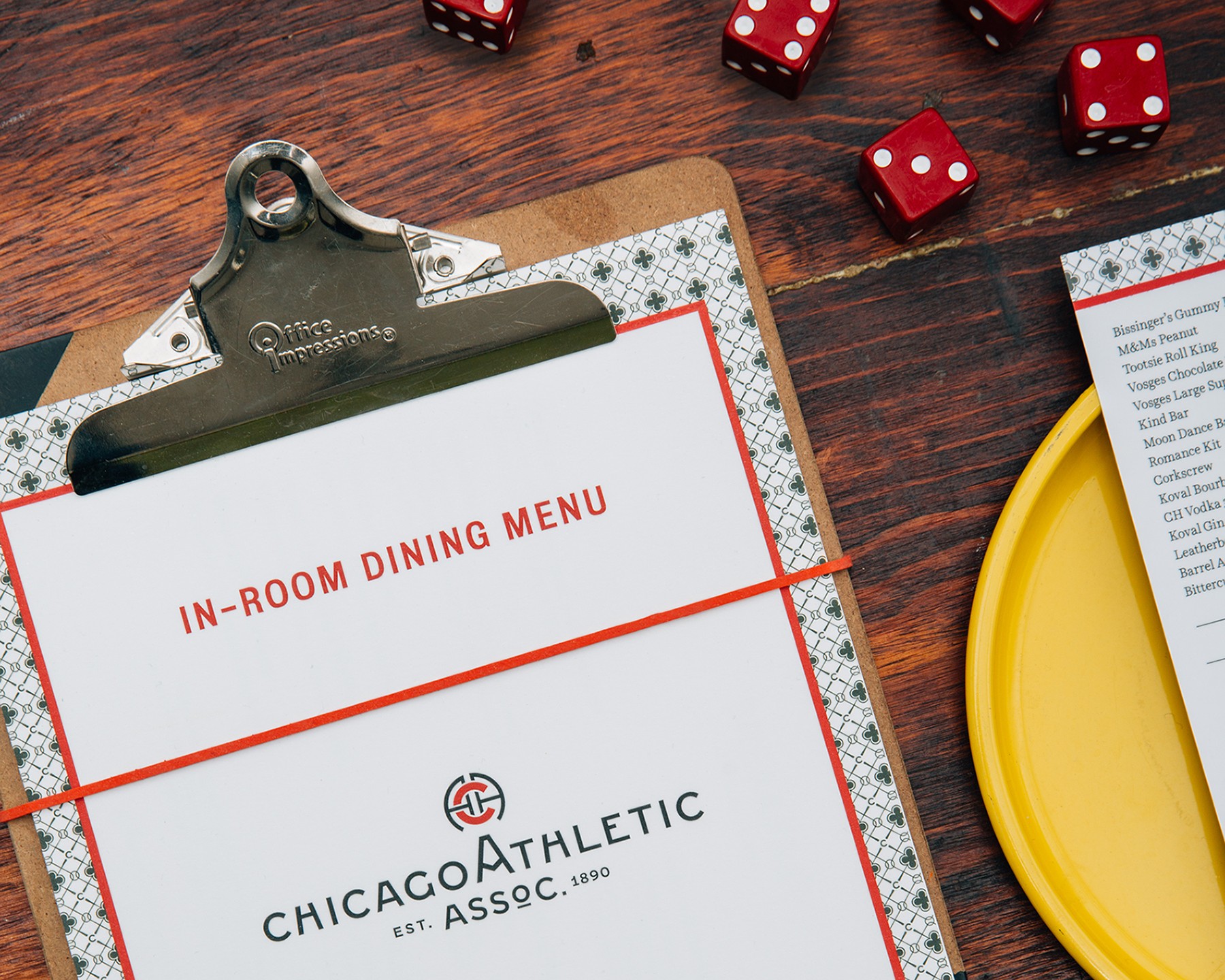 Detail shot of clipboard menu with red dice.