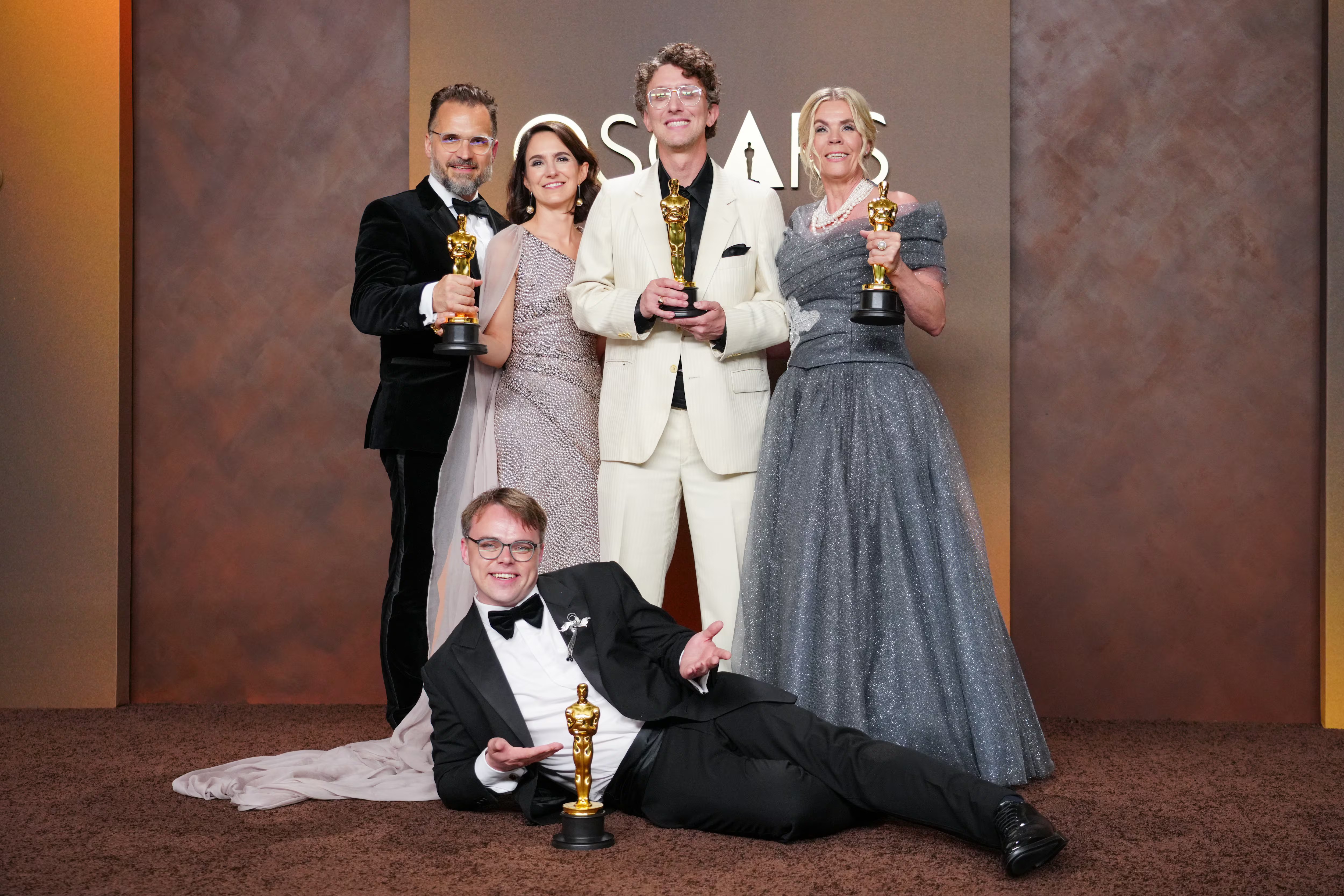 photo of the film team with their Oscars