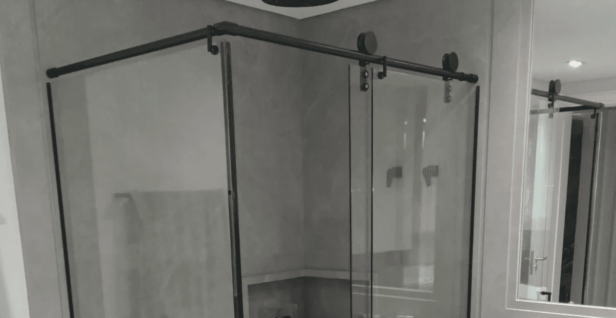 man wearing gray polo shirt beside dry-erase board