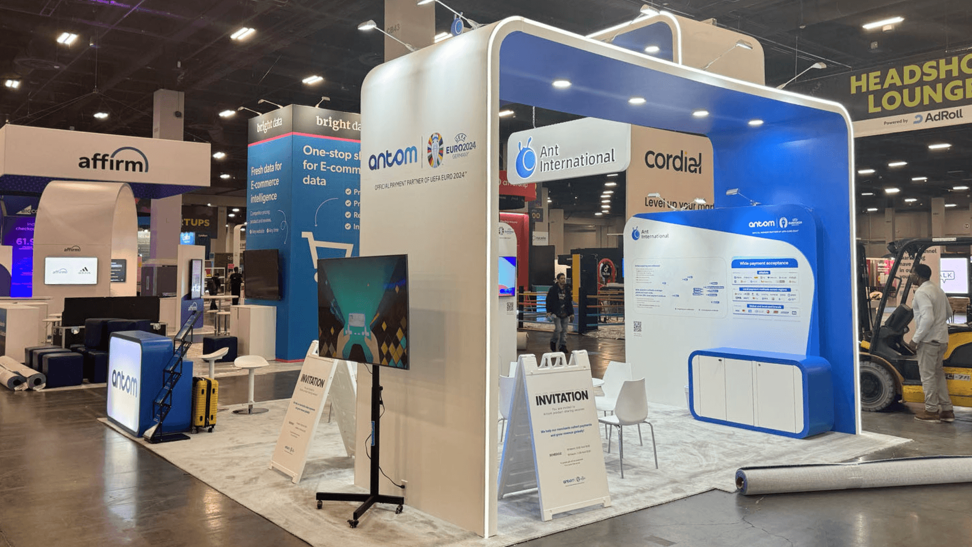 Sabre Industries NATE UNITE 2025 20x20 telecom infrastructure booth at Raleigh Convention Center with front reception area, open island layout, and contractor-facing meeting flow