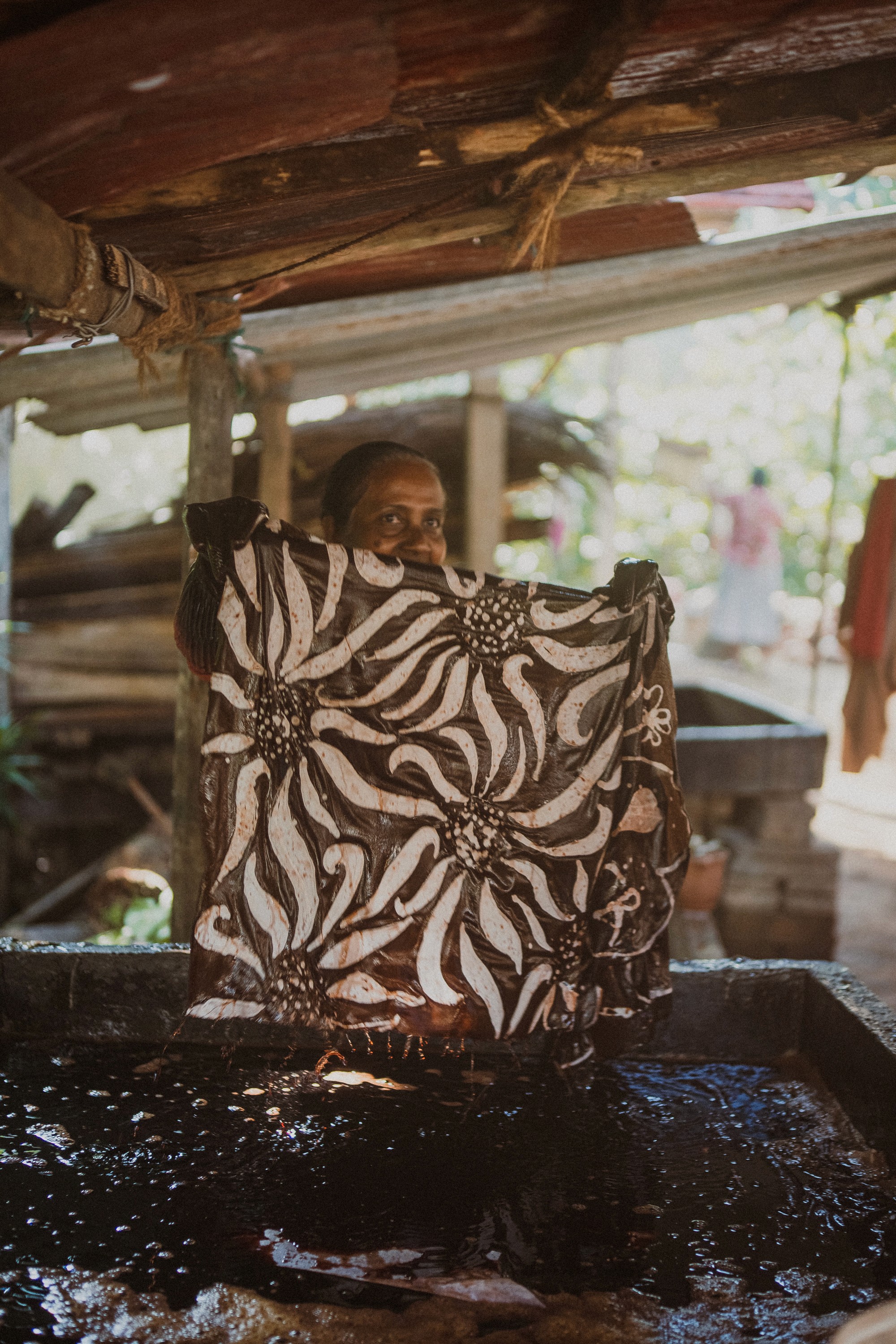 a group of women standing on top of a sandy beach