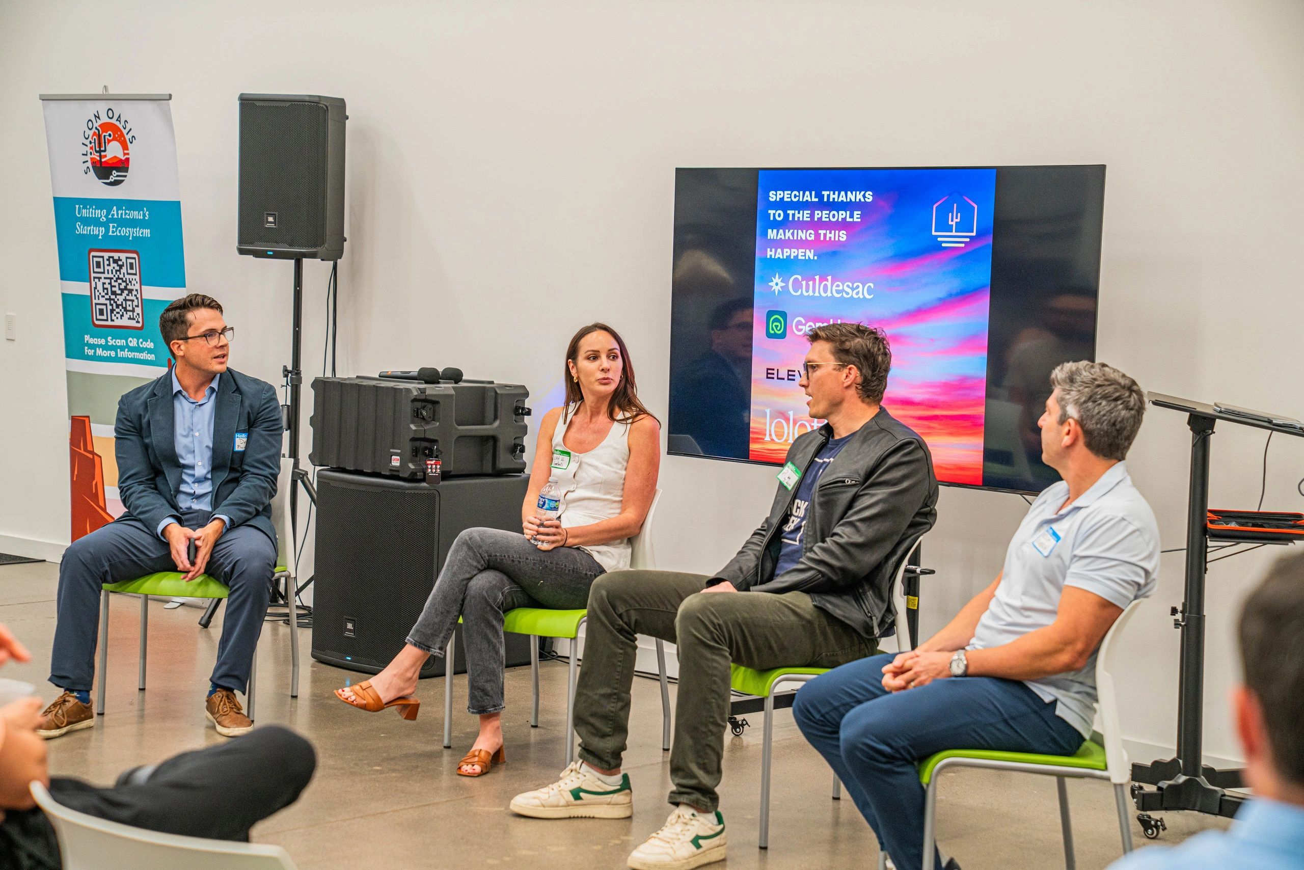a black and white living room with a large tv