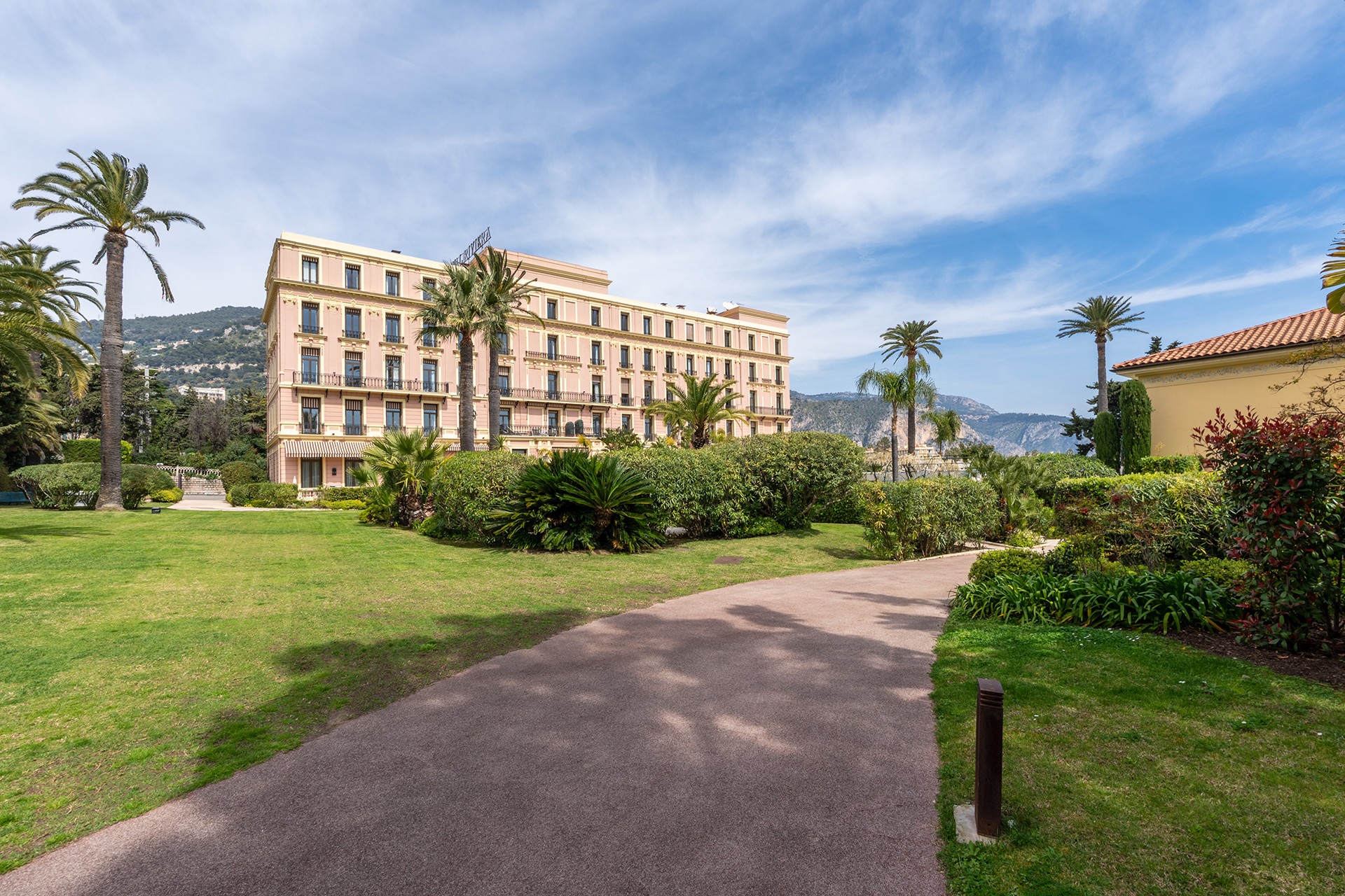 Royal Riviera Hotel exterior with landscaped gardens and palm trees in Saint-Jean-Cap-Ferrat