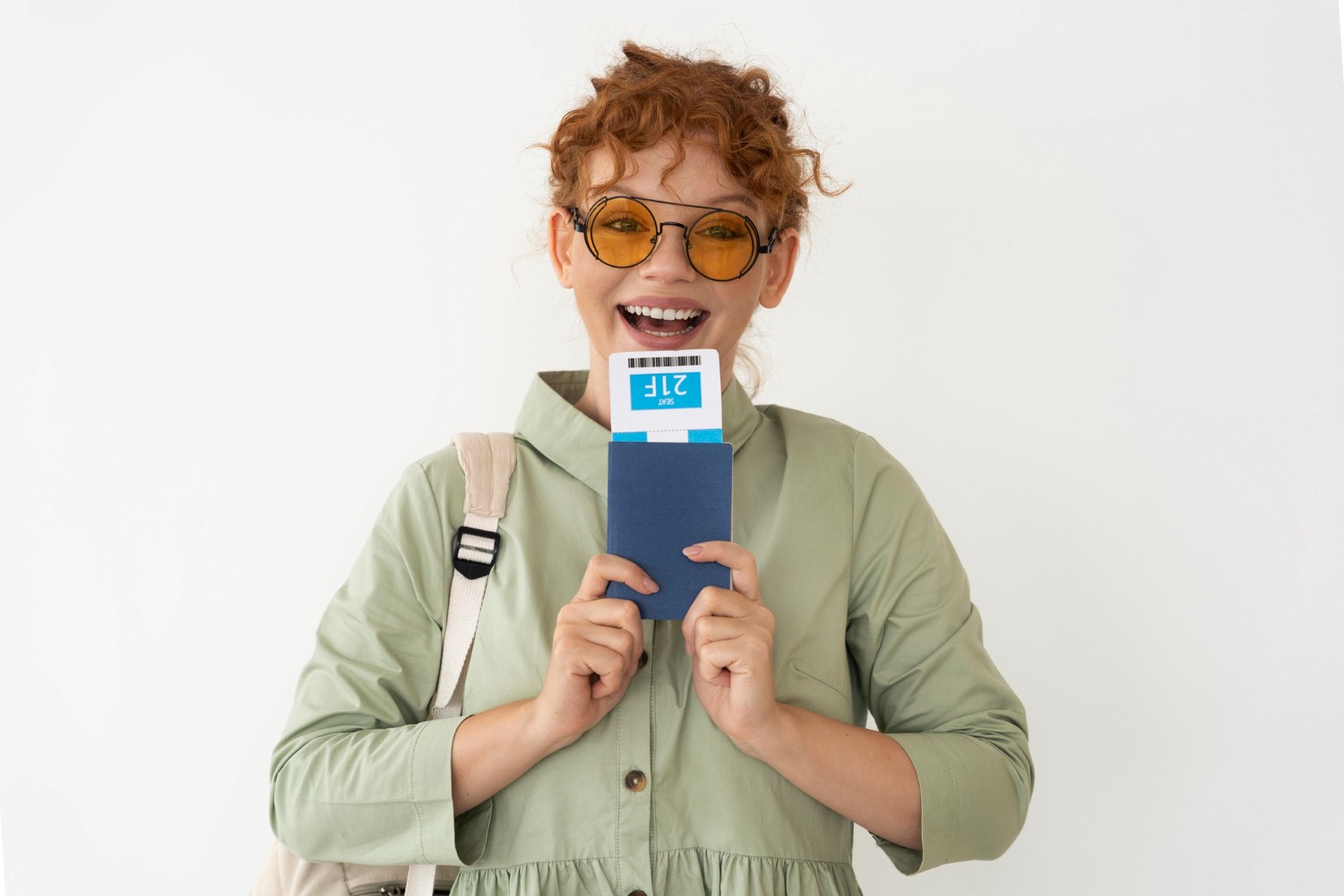 Happy girl with passport and boarding pass