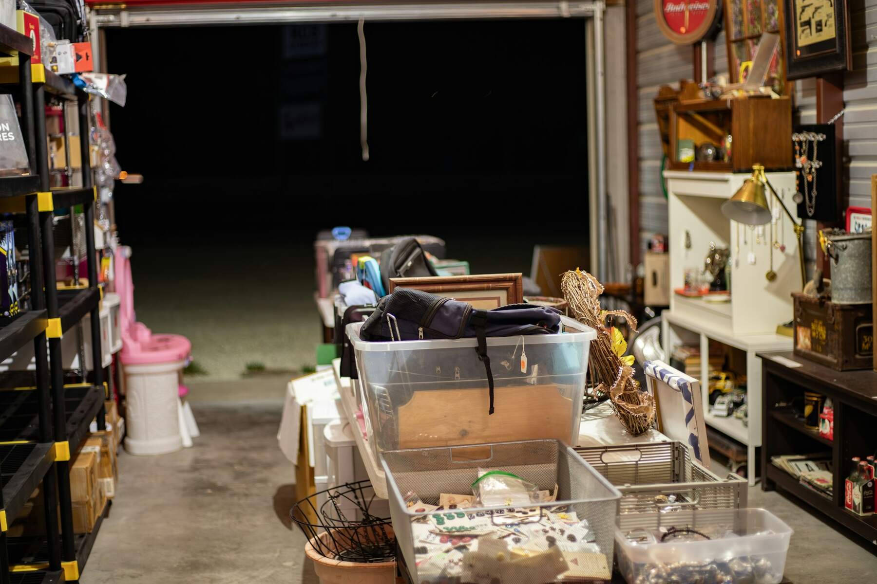 Garage with boxes and bins set out for sorting or donation